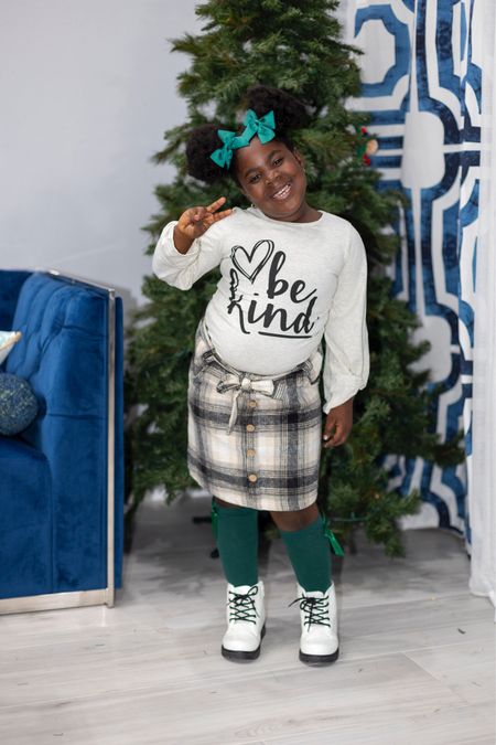 Your sweet little one will look oh-so-adorable in this "Be Kind" Cream and plaid Skirt Set for girls. This set features a cream long-sleeve top that looks adorable paired with the matching plaid skirt.
#kidsoutfit #boutiquefashion #christmaslook #sparkleinpink

#LTKkids #LTKstyletip #LTKHoliday