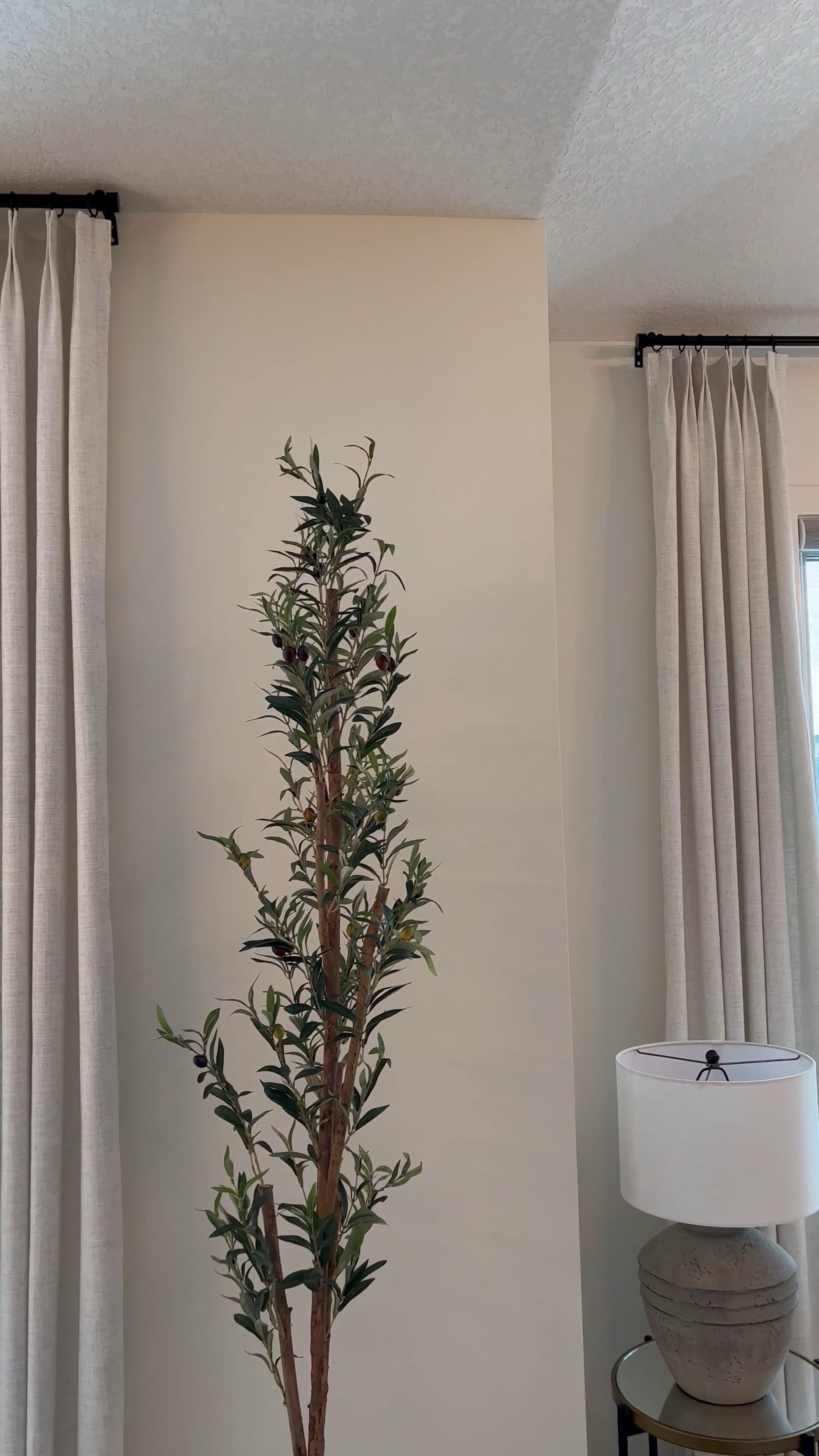 Happy Monday, my friend! 💕 I've decided to give this space a fresh new look, and it brings such a serene ambiance that I adore. And the best part? You can recreate this style – just click below ⬇️

My drapes, in the enchanting color birch #5, perfectly complement my 9-foot ceiling with their 106-inch length and 43-inch width. Don't worry; I've got all the details covered for you, from the exact curtain rod and rings I used to the convenient hooks that come with the drapes. 🫶🏾🏡💕 Click the links below and shop to create this same serene atmosphere in your home!  
#HomeDecor #minimalhome #accentchair 

#LTKstyletip #LTKhome #LTKsalealert