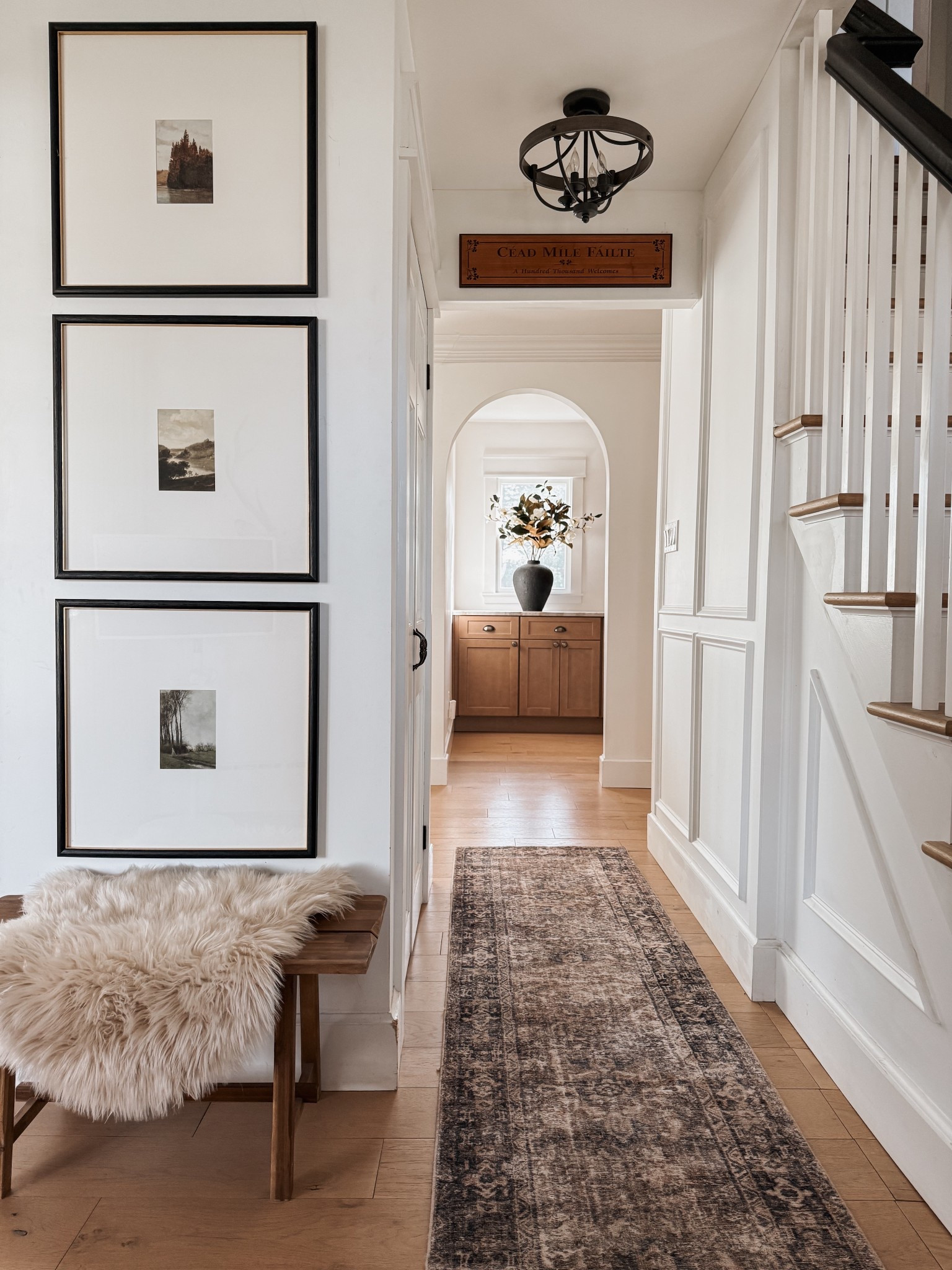 Wall art, gallery wall, small space decor, bench, area rug runner, vase, spring faux magnolias, lighting. 

#LTKHome #LTKStyleTip #LTKSaleAlert
