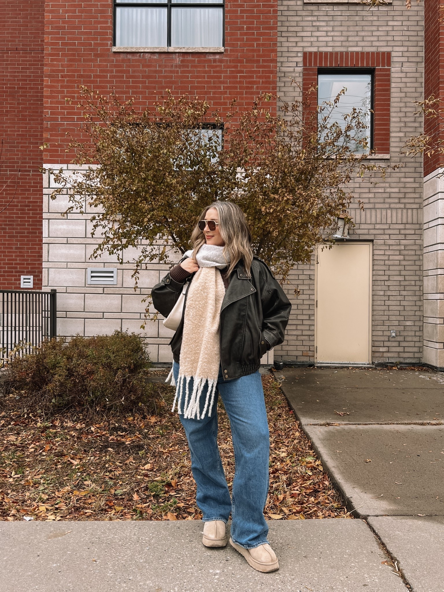 Winter ootd! Wearing my usual size L in the leather jacket and white tee. Sized up to XL in the sweater for an oversized fit. Wearing 32 in the jeans, could have done 31 but I like a looser fit. Ugg tazz are super comfy, I’m a 9.5-10 shoe and wear a 10. Linked this year’s version of my scarf. Canadian Old Navy links are under “similar products"

#LTKwinter #LTKmidsize #LTKfall