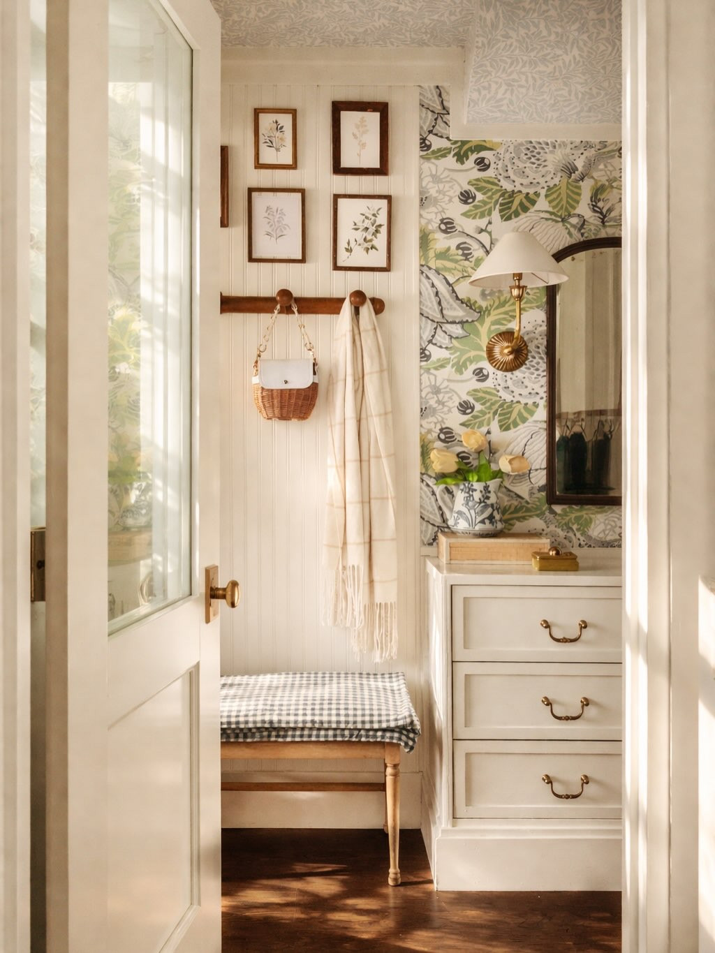 This isn’t the full reveal… but it does show one of my favorite views in this space.

I’m 99% finished. The full colorful closet reveal is coming soon. All I need is something to frame my little quilted heart for the gallery wall, and somehow that feels poetic and very me. After months of wallpaper, paint, trim, and second guessing… it comes down to a heart.

If you scroll back, this started as a dark, narrow hallway. No windows. Just a pass through space that didn’t feel like it belonged to anything. I wanted to turn it into my dream colorful closet, but with a long footprint like this, I wasn’t sure how much it would actually give me.

Instead of relying on one paint color, I layered color through two different wallpaper patterns. Pattern on the walls. Pattern on the ceiling. To keep it cohesive, I painted the wood the exact background color from the ceiling wallpaper. That choice grounded the whole room and let the patterns feel collected rather than chaotic.

There’s no natural light in here, so I added a frosted glass door to borrow it. Yesterday the light poured in and it felt completely different. Today it’s gray and flat and I’m glad I caught it when it was glowing. You can swipe to see how this hallway renovation evolved over time.

Did I know it would land exactly like this? No. Renovation rarely follows the first plan. The space answers back. It tells you what works, what doesn’t, what fits your life. And somewhere between vision and reality, something more personal takes shape.

Full reveal coming soon. Just waiting on a frame for a quilted heart.
#casasconencanto #closetinspo #homeinspo #decorinspo #dailydoseofcolor