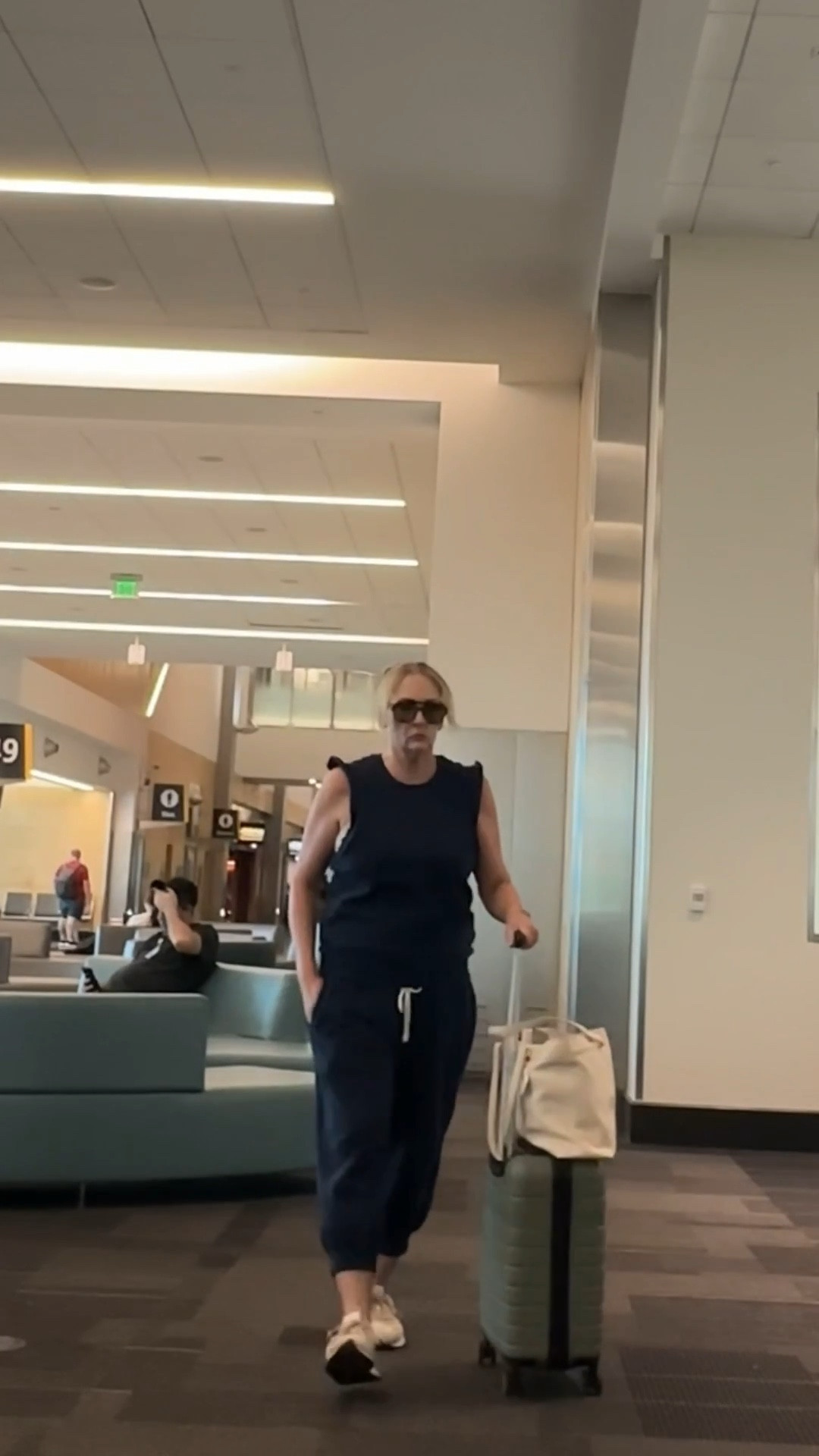 Stylish & comfortable Free People joggers & matching sleeveless sweatshirt in Navy Blue✨Paired with New Balance sneakers & Bugatti luggage. Shop Nordstrom for this entire look✨

#LTKOver40 #LTKTravel #LTKActive