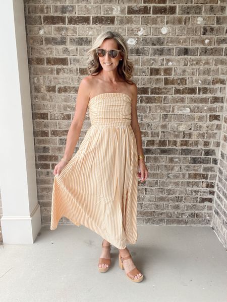 This stunning maxi dress features a trendy tube neck and strapless design, perfect for any occasion. The flattering flare silhouette, lining and smocking detail add both style and comfort to this must-have dress. Elevate your wardrobe with this dress and make a statement wherever you go! Wearing size small 

#LTKStyleTip #LTKFestival #LTKParties