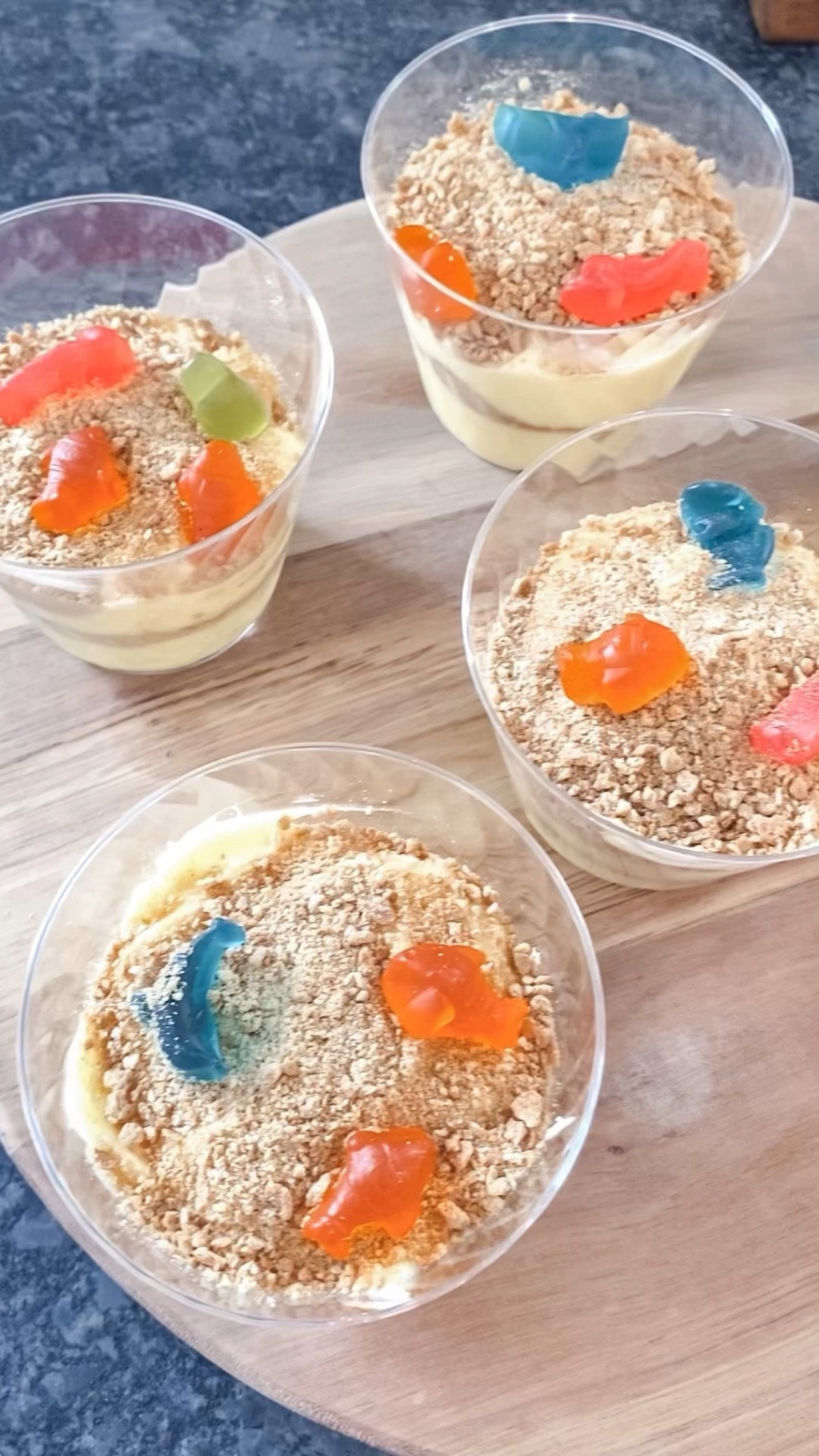 Make a dessert paradise with these adorable Beach Pudding Cups! 🌊🐠

See how to turn vanilla pudding into a sandy beach getaway complete with ocean vibes. 

What You'll Need:
- Vanilla pudding (boxed or homemade)
- Graham crackers
- Dye-free sea creature gummies
- Food processer

Step-by-Step:
1. Prepare Pudding: If using boxed pudding, follow the instructions to whip up that creamy goodness or use your favorite homemade vanilla pudding recipe!

2. Get Your Crush On: Grab graham crackers and crush them up using a food processor. The coarser, the better – we're aiming for that sandy texture. 🏖️🍪

3. Layer It Up: Time to build your beach masterpiece. Spoon in a generous layer of the vanilla pudding

4. Sandy Shores: Sprinkle your crushed graham crackers on top of the pudding. This is where the magic happens – your beach is coming to life! Repeat with another layer of each.

5. Sea-sational Touch: Top with adorable dye-free sea creature gummies on the 'sand' – think fish, seahorses, or even a jellyfish!

6. Snap & Savor: Capture your edible beach paradise and take a moment to admire your creativity with your child. Then, enjoy the sweet, sandy goodness! 😍📸

A little dessert adventure that brings the beach to your spoon. Whether you're building sandcastles, riding pudding waves, or just taking a beach snackcation, these Beach Pudding Cups are the perfect way to add some fun to your day.

#LTKkids #LTKSeasonal #LTKfamily
