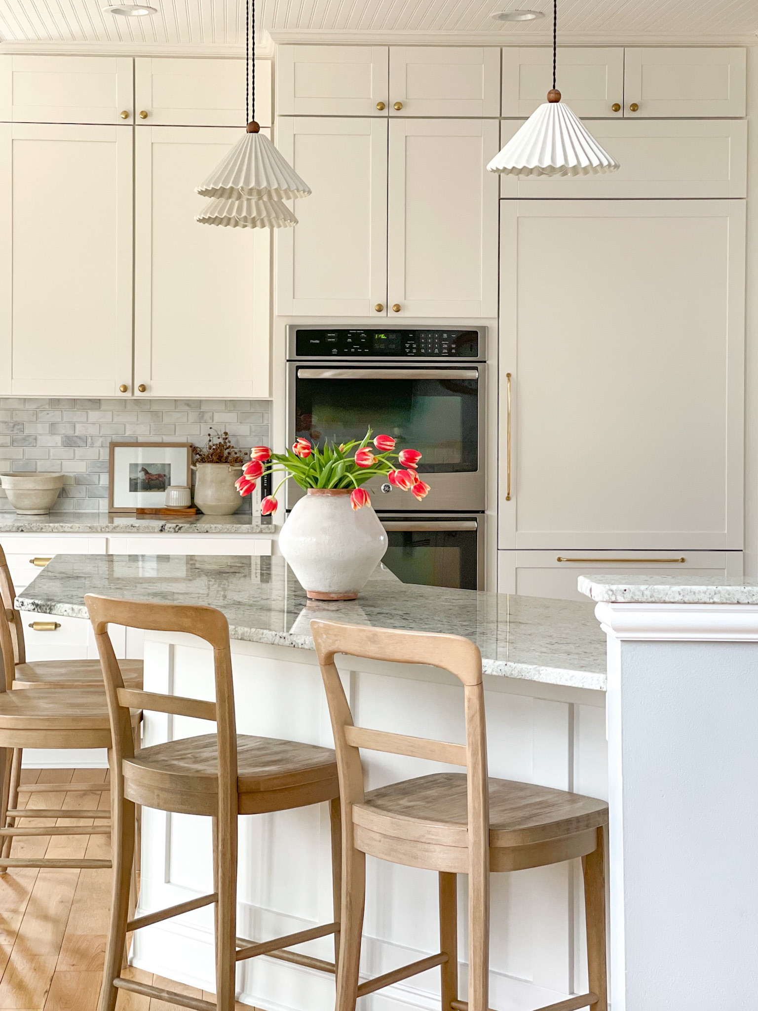 Kitchen, white kitchen, cottage kitchen, panel ready appliances, stools, granite, pottery barn, beadboard, shiplap, home decor, interior design, house, brass hardware, rejuvenation, tulips, cozy home 

#LTKSale #LTKunder50 #LTKhome