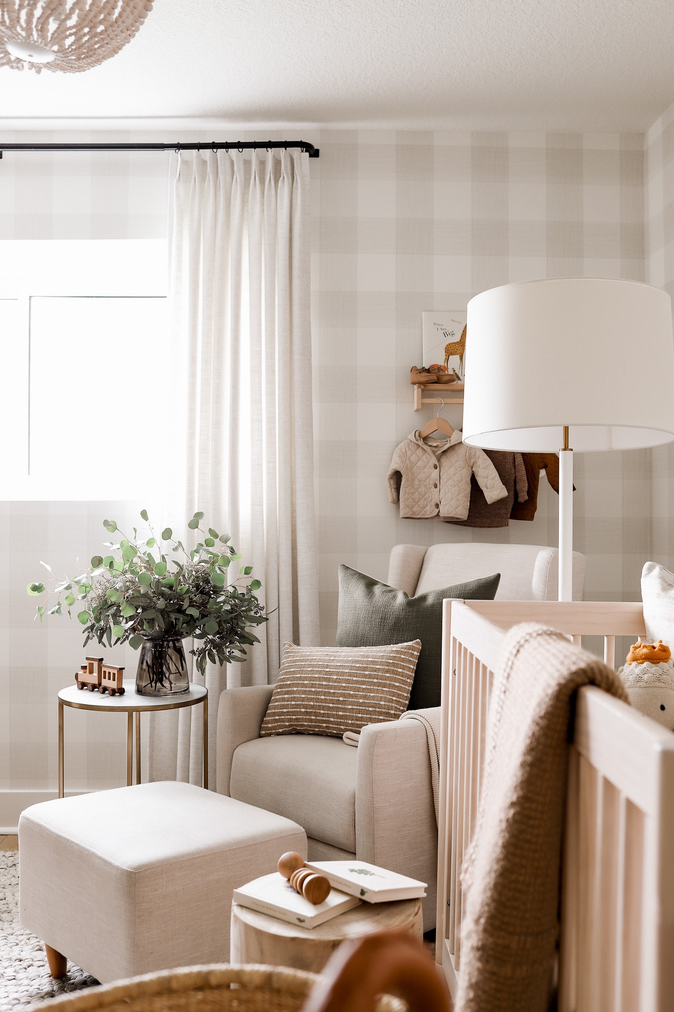 Nursery decor and furniture! For more links and details see the whole blog post at halfwaywholeistic.com and search ‘nursery’. 
WALLPAPER: ‘Fog Green’. It’s much more neutral in person than it is online! A gorgeous putty/beige/green color 
CURTAINS: ‘beige white’