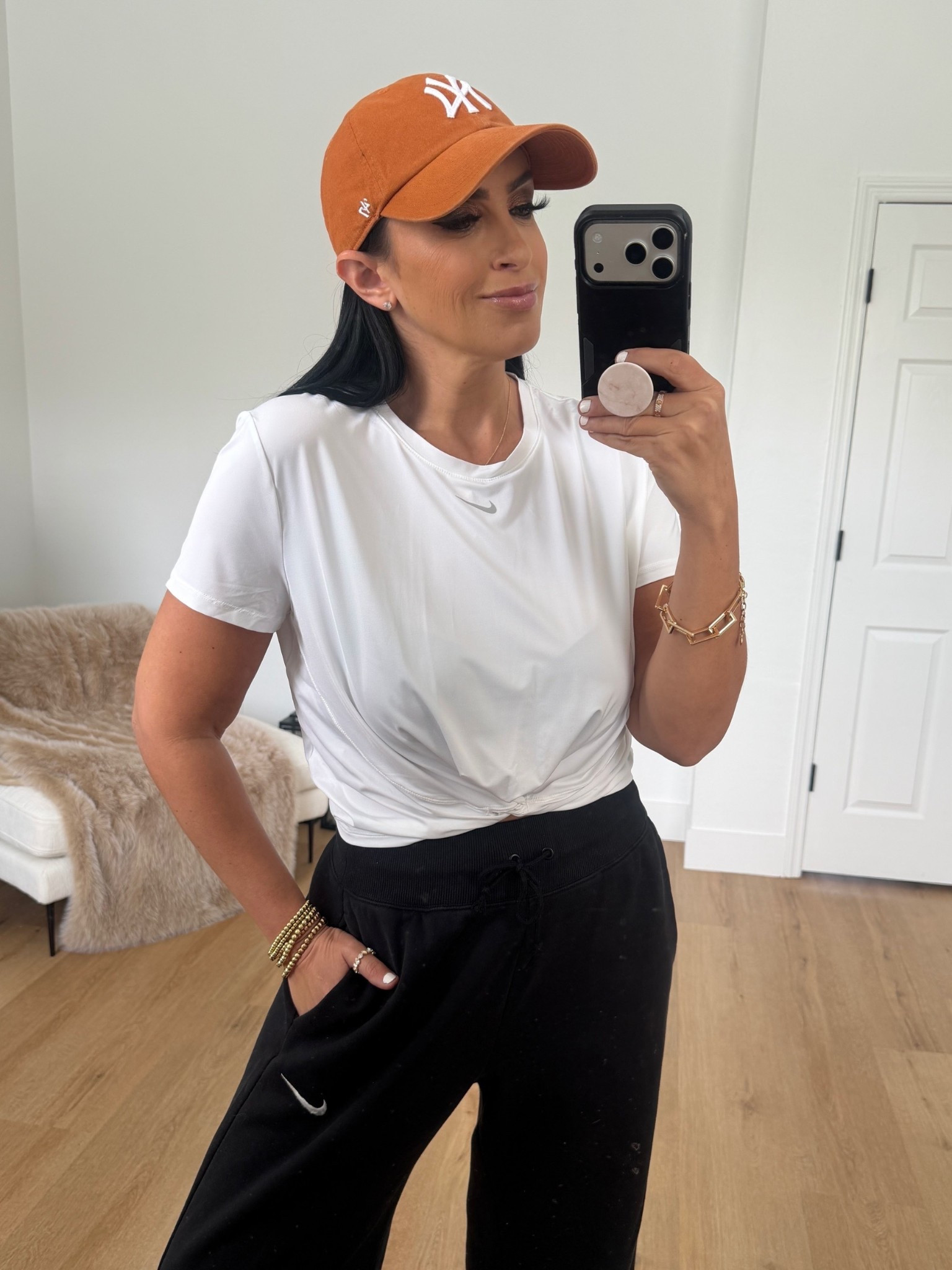 Nike One Classic Twist Women's Dri-FIT Short-Sleeve Top wearing size medium. Sportswear Phoenix High Waist Wide Leg Sweatpants wearing size medium. 