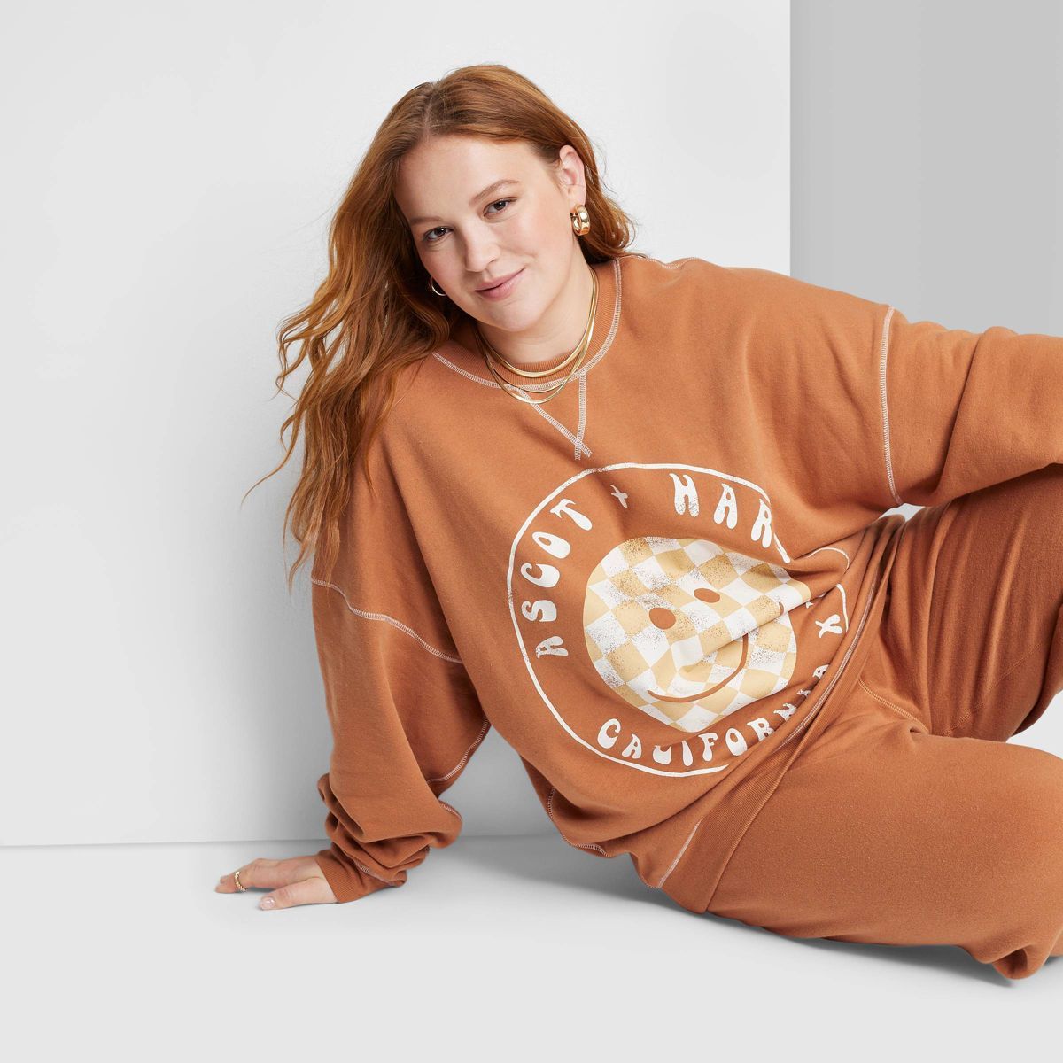 Women's Ascot + Hart Checkered Smile Graphic Pullover Sweater - Orange | Target