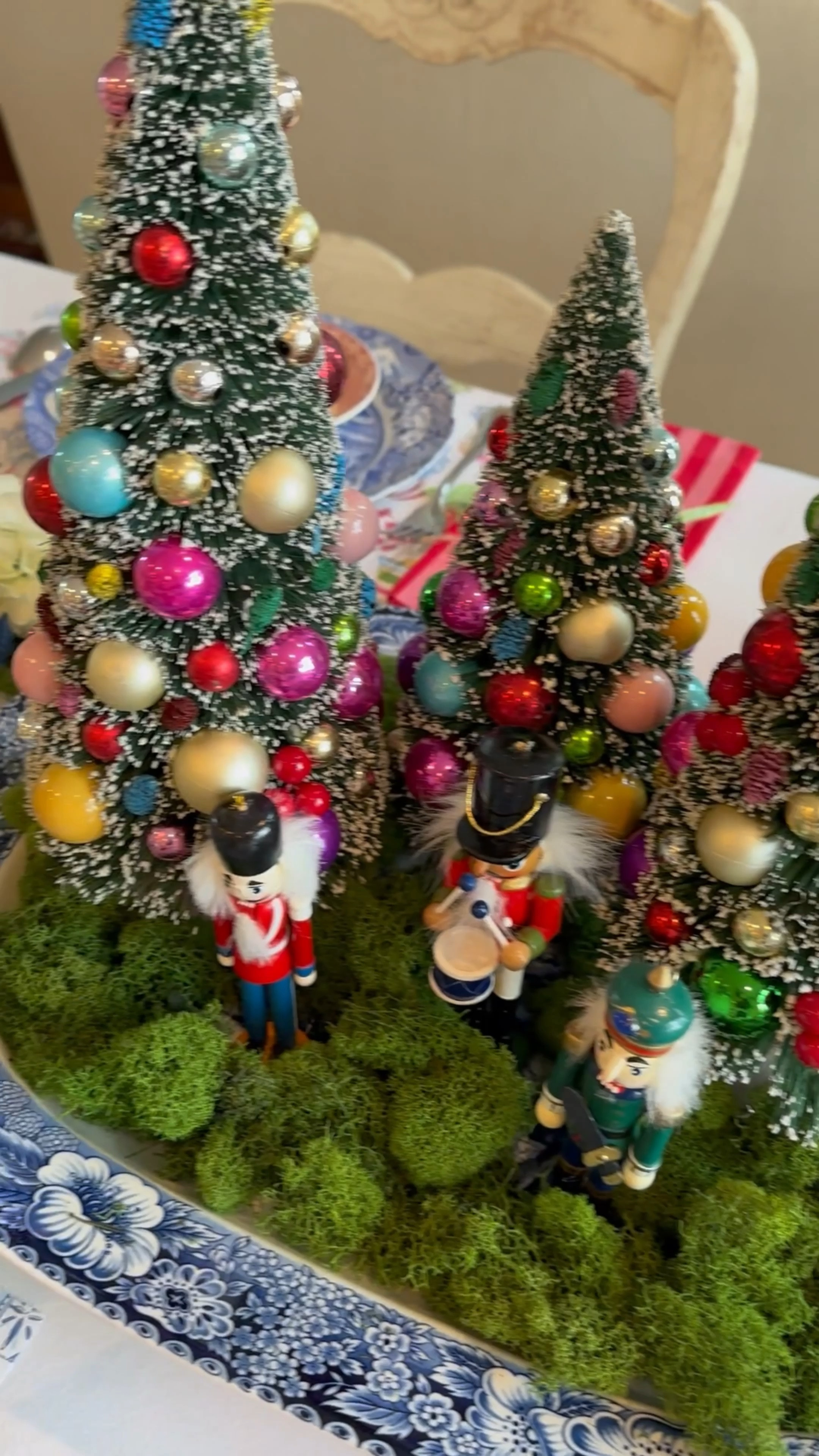My first Christmas table of the season is a bright a happy nutcracker table. Love the fun Christmas tree centerpiece and the red and pink striped napkins.  The paper placemats are so fun and the little nutcracker ornaments tied onto each napkin really make the table. Christmas table. Christmas decor. Christmas tree. Nutcrackers. Terrain. World Market. Rosanne Beck. Spode  

#LTKSeasonal #LTKWatchNow #LTKHoliday