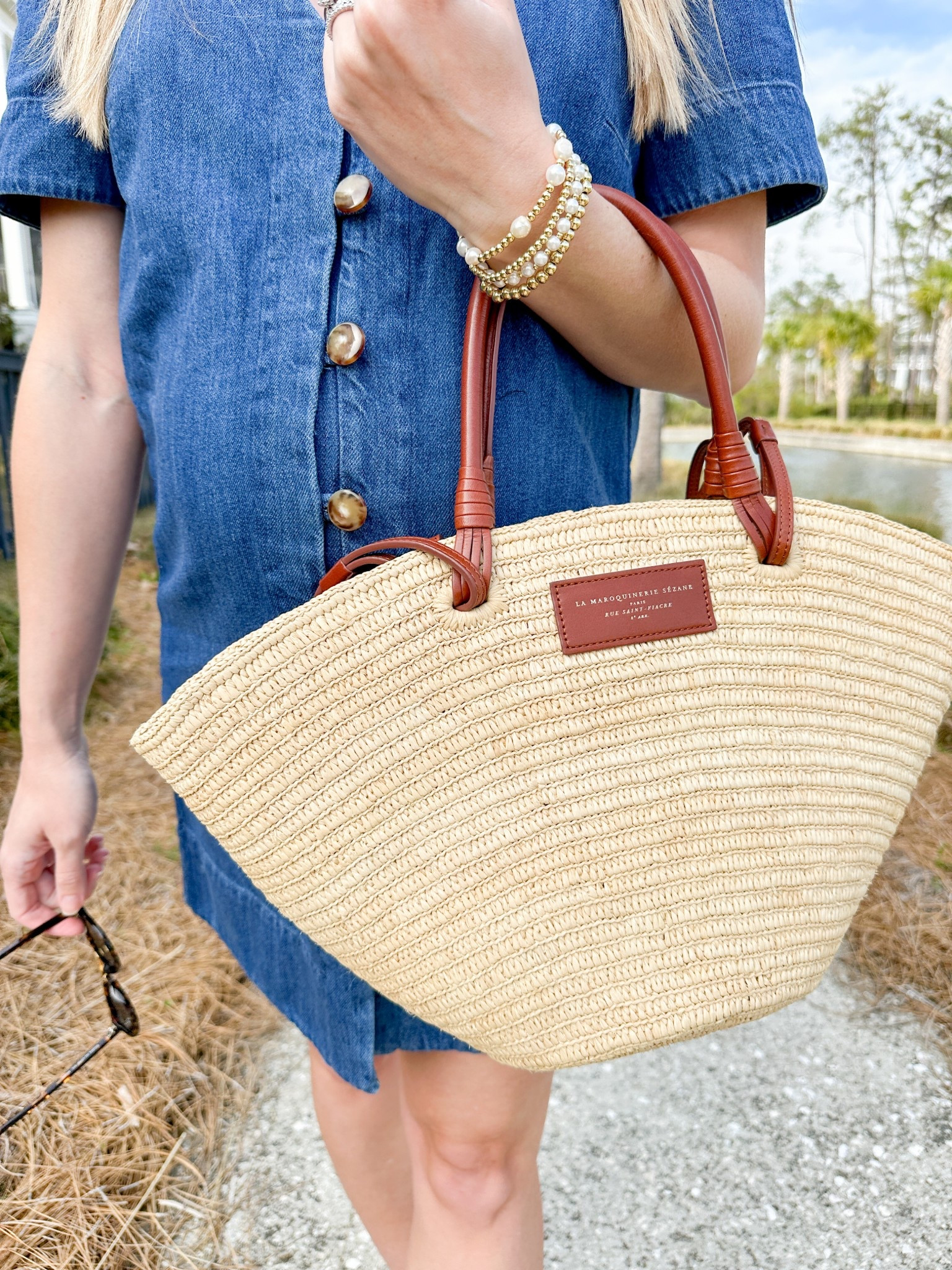 Gold button from denim dress / raffia tote / gold bead and pearl bracelets / krew dupe sunglasses 

#LTKSeasonal #LTKSpringSale #LTKStyleTip