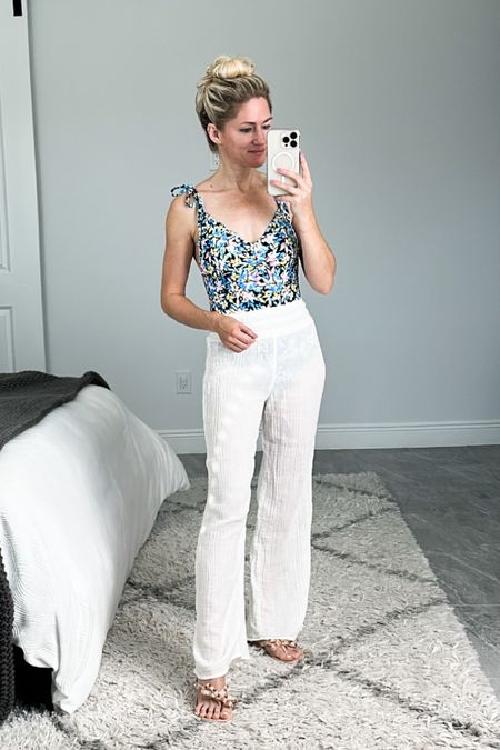 Todays swim look. Tie strap floral one piece suit from Target. I love the deep scoop back! Gauze coverup pants from Abercrombie so soft and lightweight. The design for this year has a drawstring. 

#LTKswim #LTKFind #LTKunder50