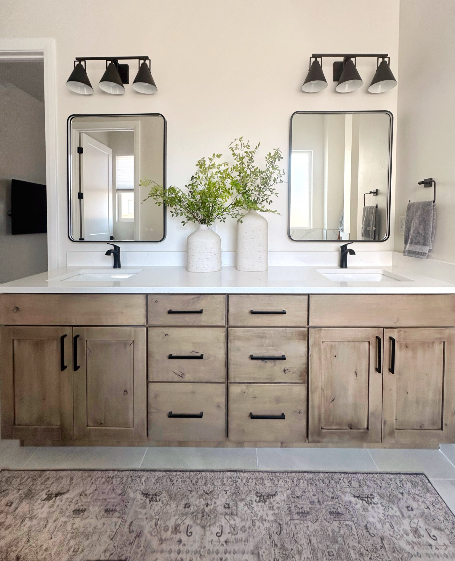 A bathroom refresher for this primary suite with all the neutral colors in black, wood, cream, and greenery! Makes for the perfect room to start and end your day! 
Check it out, some of my home decor items are on sale this week. Snatch them up before they are gone. My bases are a viral hit! #LTKFallSale

#LTKSaleAlert #LTKHome