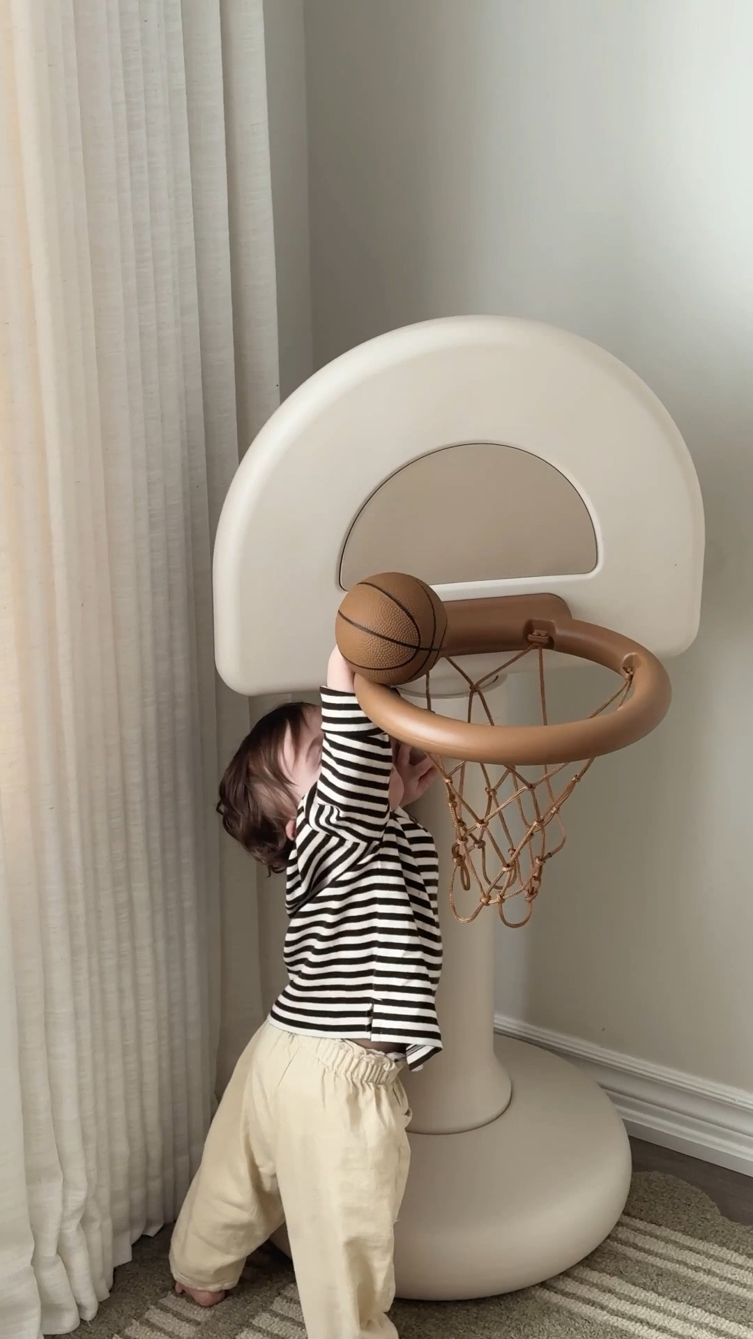 Don’t get me wrong - I completely understand why colour is so, so important in children’s play & you’ll find plenty of colour within our toy baskets.. 

but the bigger pieces? they don’t need to feel loud to be loved. I’ve found that when the larger play items - the ones that stay out on display every day- are neutral and calming, our home feels more peaceful, and their imagination still runs just as wild. Especially when these toys will be around for a few years and grow with them.

the colour is there, the creativity is there, the fun is definitely there - it just doesn’t have to shout.

The basketball hoop we got the kids this year is the perfect example of that.. I’m happy to have it our 24/7 & they love it so, so much 🤎


#LTKkids