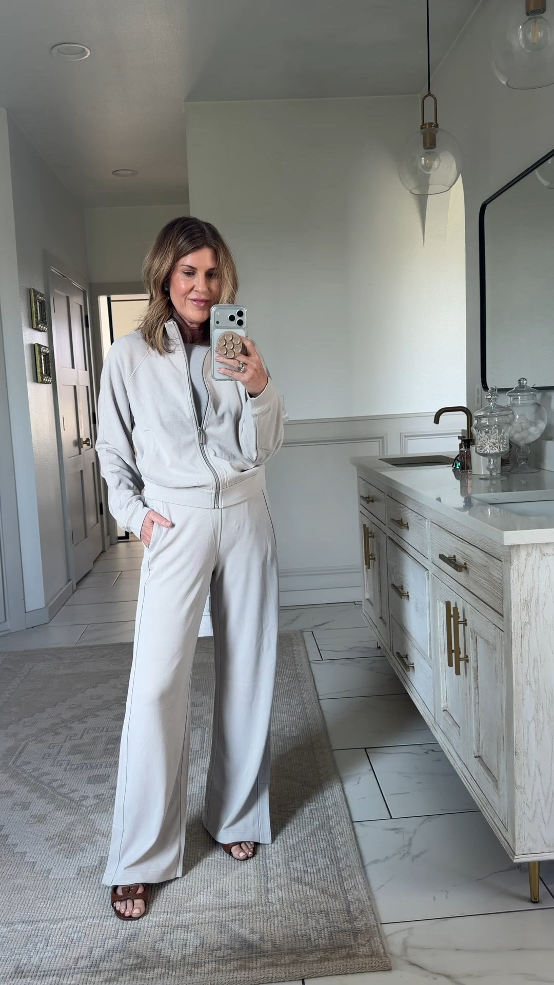 Wearing a small in the soft high rise wide leg pique pants in Downtown tan with matching track jacket also a small 

#LTKActive #LTKOver40