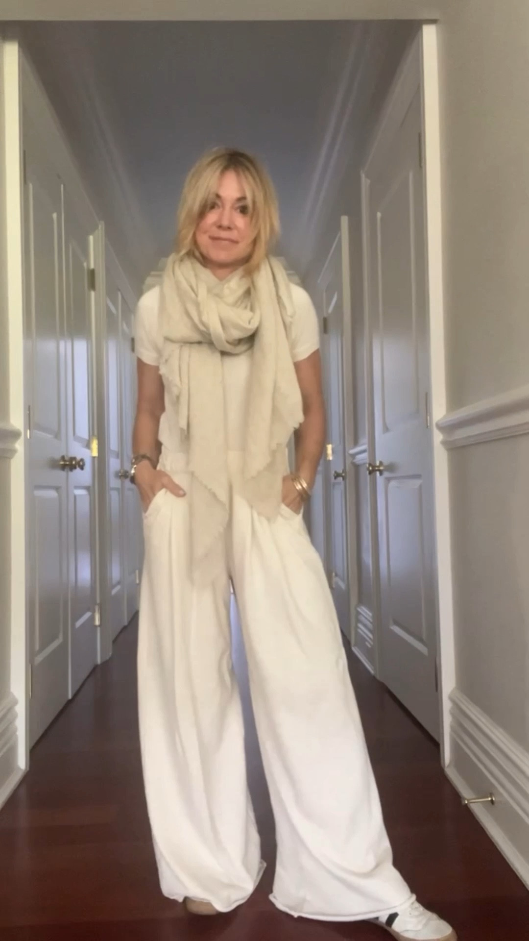 What I wore for a redeye flight to Paris: trouser sweatpants + cashmere tee + scarf blanket + trench coat 