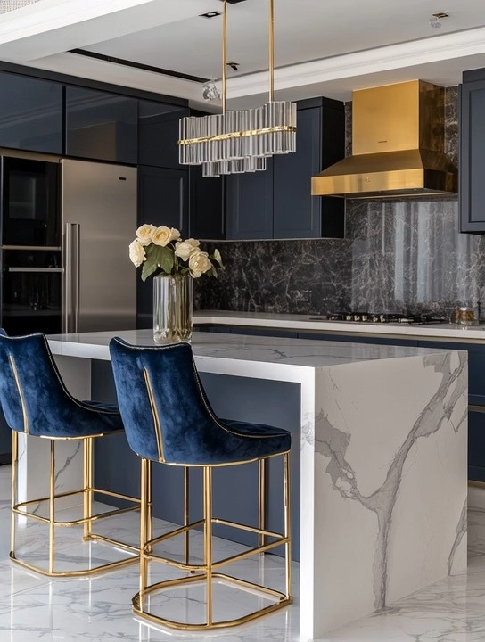 Add instant luxury to your kitchen by introducing just two to three statement pieces that work together effortlessly. These gorgeous velvet kitchen chairs with gold accents paired with a striking gold range hood instantly elevate the entire space. When you repeat finishes—like gold metal details across seating, lighting, or appliances—the kitchen feels intentional, cohesive, and designer-level without a full renovation. This simple rule of matching two to three elements makes bold materials like velvet, marble countertops, and gold accents feel balanced and timeless. A perfect example of how small, thoughtful upgrades can transform a modern kitchen into an elegant, high-end space.

#LuxuryKitchen #GoldKitchenAccents #VelvetBarStools #KitchenUpgrade #ModernKitchenDesign #DesignerKitchen #GoldRangeHood #MarbleKitchen #KitchenIslandDesign #ElegantInteriors #KitchenInspiration #StatementKitchen #HomeDecorIdeas 

 #LTKHome