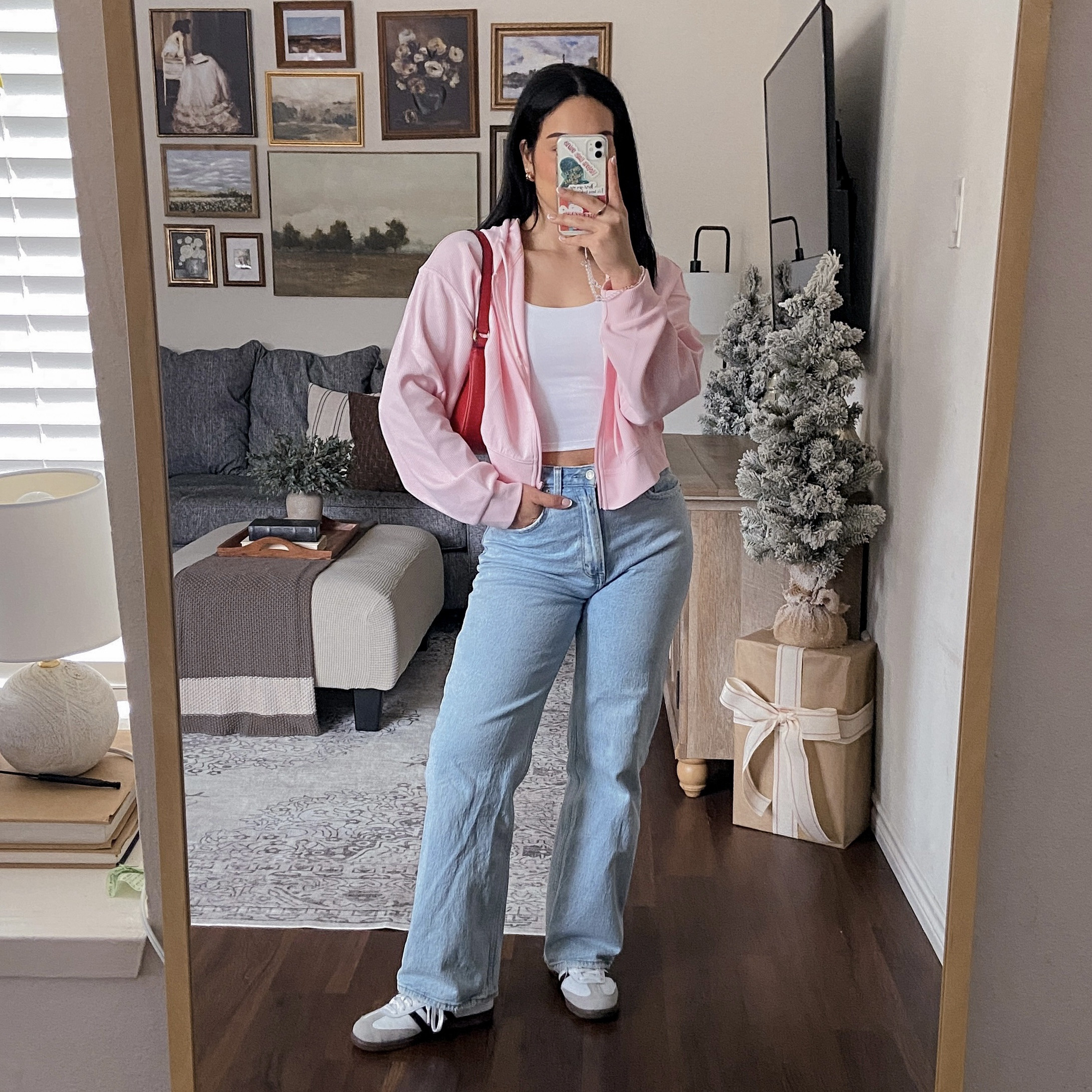 I’m wearing this pink hoodie in a size large for a roomier fit. The waffle knit texture fabric is not itchy or scratchy, and it’s lightweight. The white cami top, I’m wearing in a size medium and it fits true to size. It has built-in padding that is removable and straps that are not adjustable. The fabric is soft, opaque, stretchy, and comfortable. This top is definitely a staple to wear in and out of the gym. Wearing the jeans in a size 28 and they fit true to size. 

🏷️: casual Valentine’s Day outfit, casual galentine’s day outfit, Valentine outfit ideas, subtle Valentine’s Day outfit 

#LTKSeasonal #LTKWatchNow #LTKStyleTip