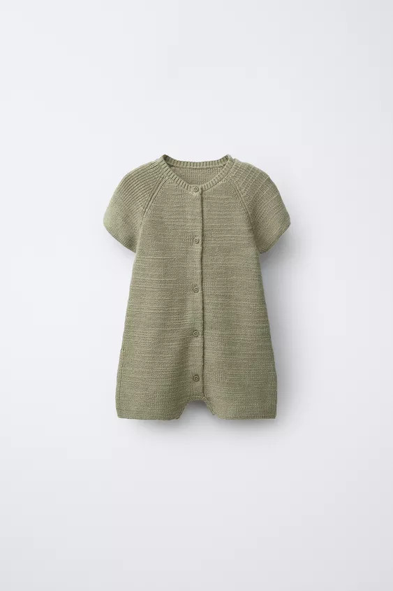 Short playsuit with a round neck and short sleeves. Front button fastening. | Zara UK
