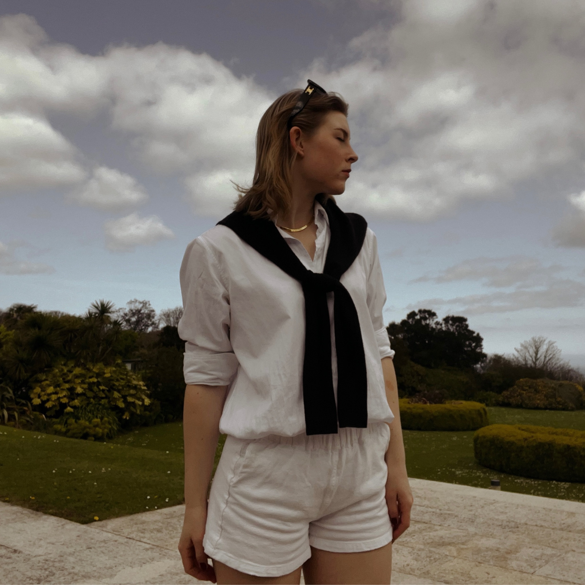 Oversized white shirt in cotton poplin, white shorts, navy crew neck jumper, gold herringbone necklace, classic black sunglasses🤍

#LTKSeasonal #LTKSpringSale #LTKfindsunder50