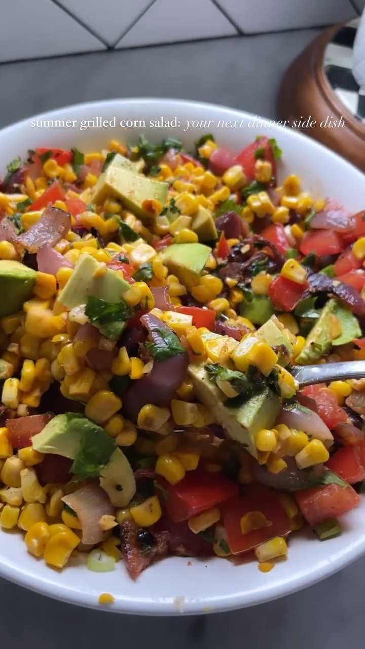 This summer grilled corn salad is my top side dish recipe and for good reason! It has all the fresh flavors of a salad combined with the sweetness of summer corn and flavors of the grill. Fresh herbs and bright vegetables make this colorful salad a great dish to serve at your next BBQ. Full recipe on www.sweetsavoryandsteph.com. Summer recipe, grilled recipe, side dish recipe

#LTKSeasonal #LTKHome #LTKParties