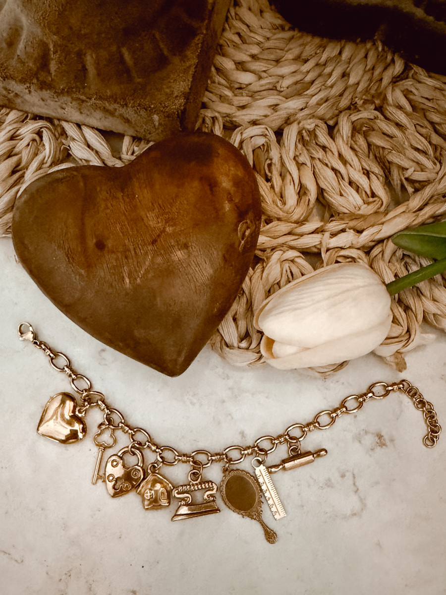 This charm bracelet from @Etsy makes an excellent Valentine's Day gift. I have it paired with this small wooden dish, a faux floral, and a placemat for added texture.  

 #LTKValentine #LTKSeasonal #LTKHome