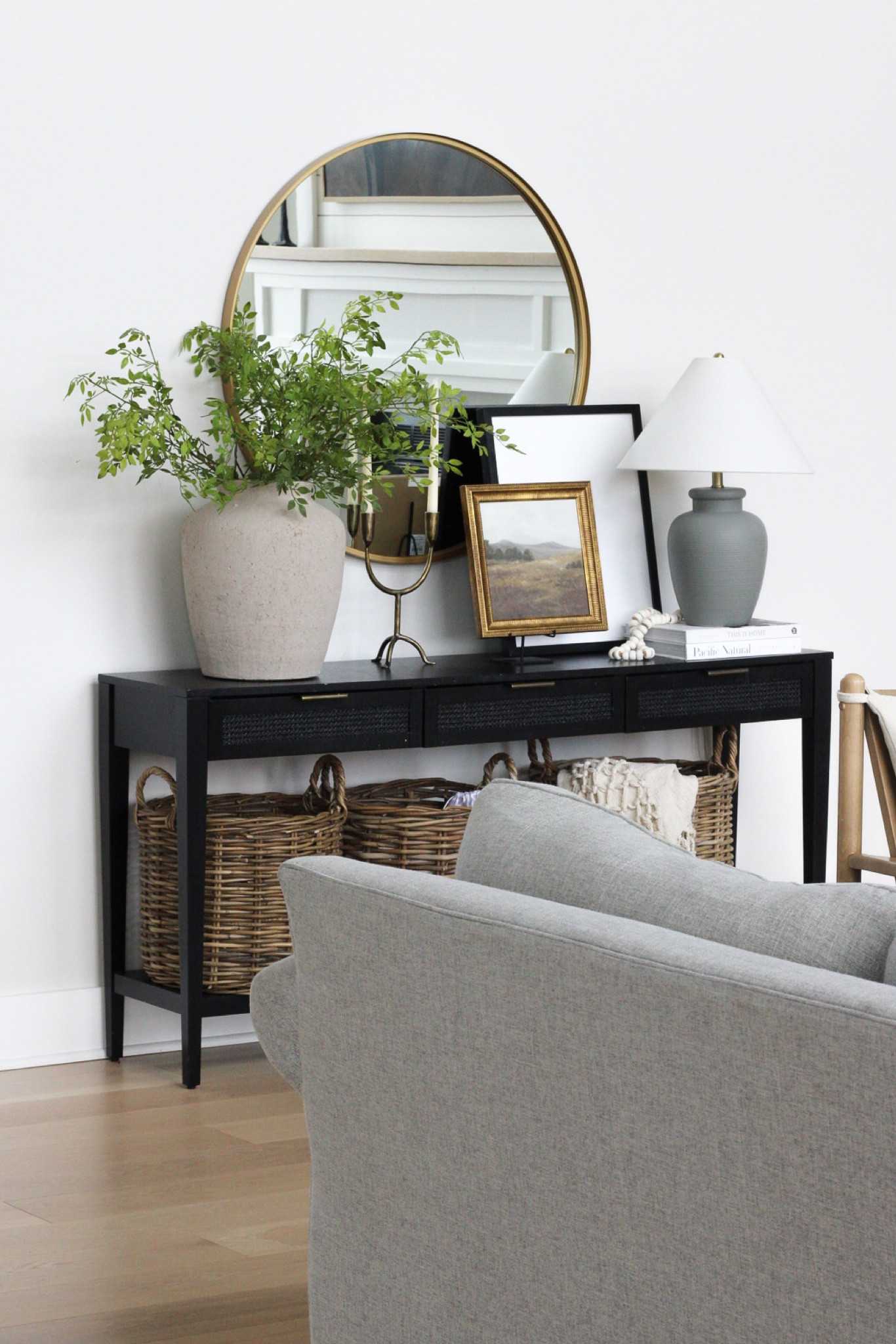 Console table styling, spring decor, modern farmhouse, black console table, round mirror, living room decor 

#LTKstyletip #LTKMostLoved #LTKhome
