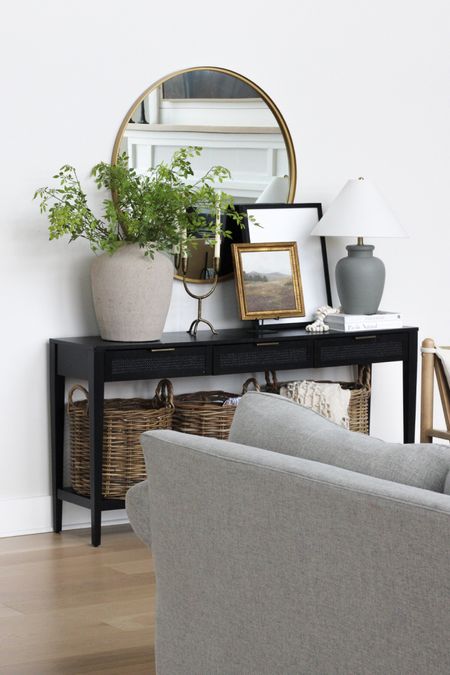 Console table styling, spring decor, modern farmhouse, black console table, round mirror, living room decor 

#LTKstyletip #LTKMostLoved #LTKhome