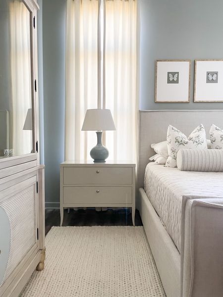 Master bedroom design. Wool braided area rug, large curvy lamps in French blue 30% off! Butterfly intaglio framed art (similar linked) and large creamy white nightstands with drawers (similar options linked). 

#LTKCyberweek #LTKhome #LTKsalealert