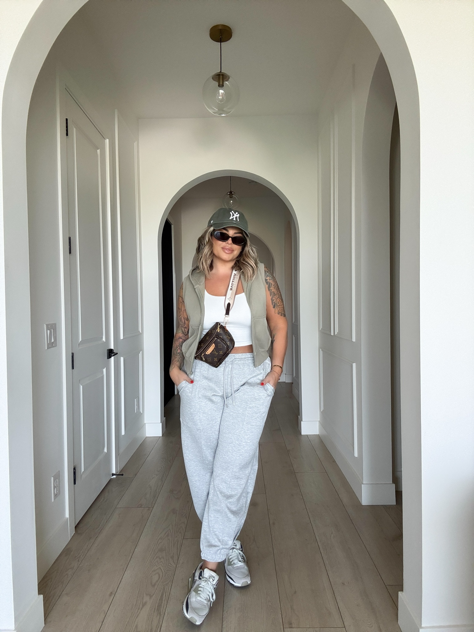 Casual busy mom outfit perfect for sports , school drop offs & running errands. 
Tank L 
Pants L  ( incredible scuba material ) love these !! 
Vest L 
Can’t link bag here I had to buy strap separate for it. It’s the mini bum bag from LV 
Sneakers are men’s I did a size 8.5 
#walmart #amazon #target 

#LTKFindsUnder100 #LTKFindsUnder50 #LTKMidsize