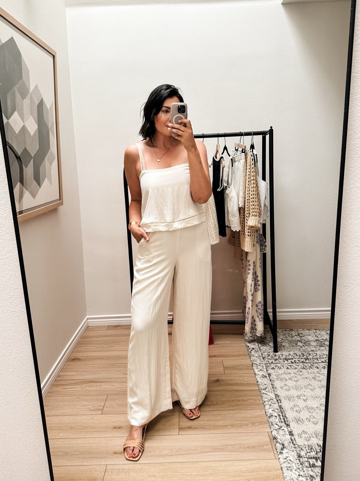 This top that goes directly with the pants, if you like a matching set. It’s the same fabric, so they match up perfectly. Now this top has a built in shelf that can act like a bra if you don’t have giant boobs like me. I love that for you. However, I woudl still need to wear a bandeu or a strapless with this for support. But I do love that the little bra shelf is included! 

The pants  are FULLY lined like all the way down. And that is SO nice when it comes to white pants. These are not linen, they’re a flowy fabric with a touch of a sheen to them. VERY comfortable but chic as well. I am in the large and they fit perfectly for me. The drawstring is adjustable but I wouldn’t say it would make that much of a difference with sizing.
 

 #LTKSummerEdit #LTKOver40 #LTKSaleAlert