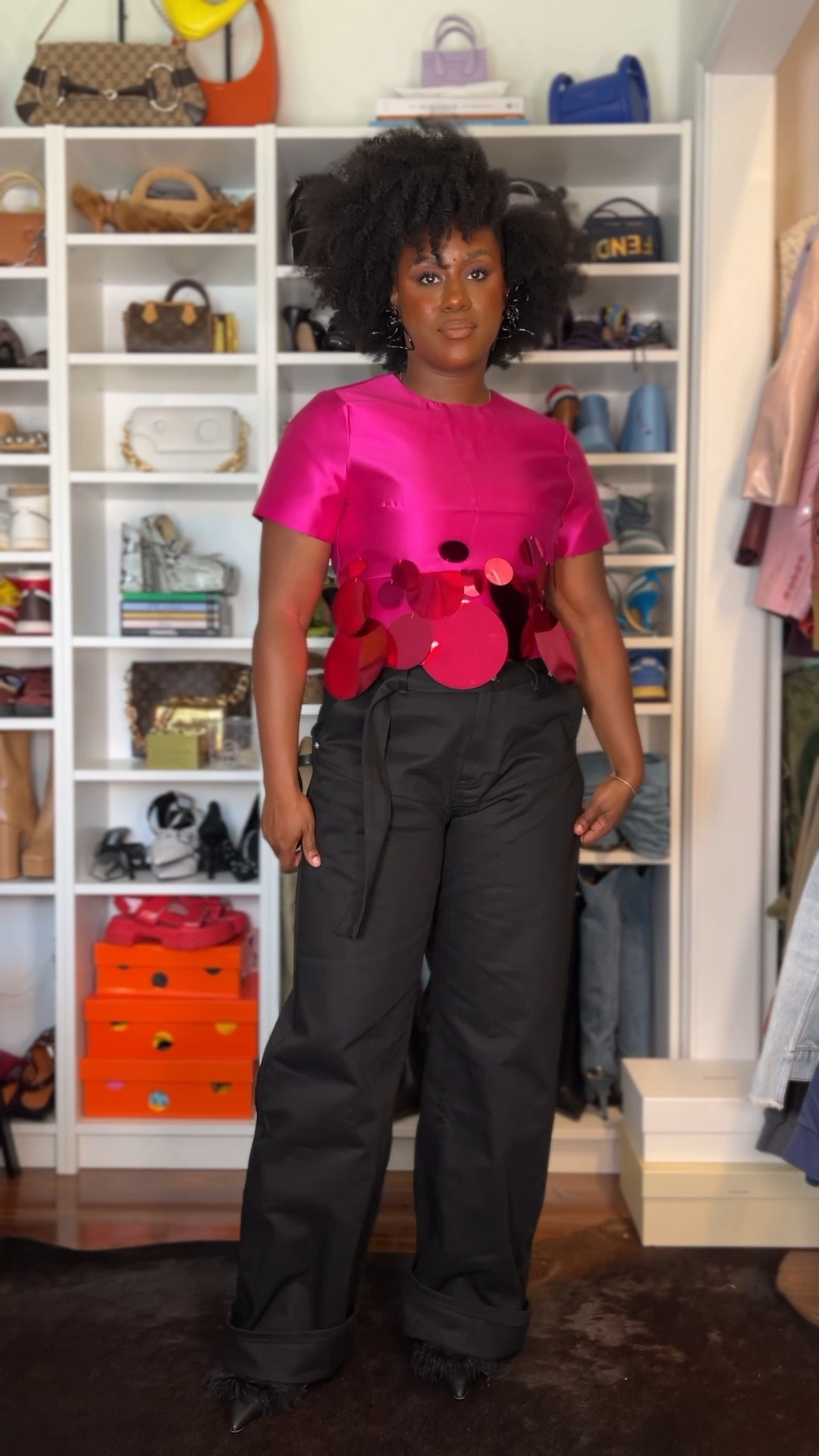 Pink statement sequin top with black jeans 