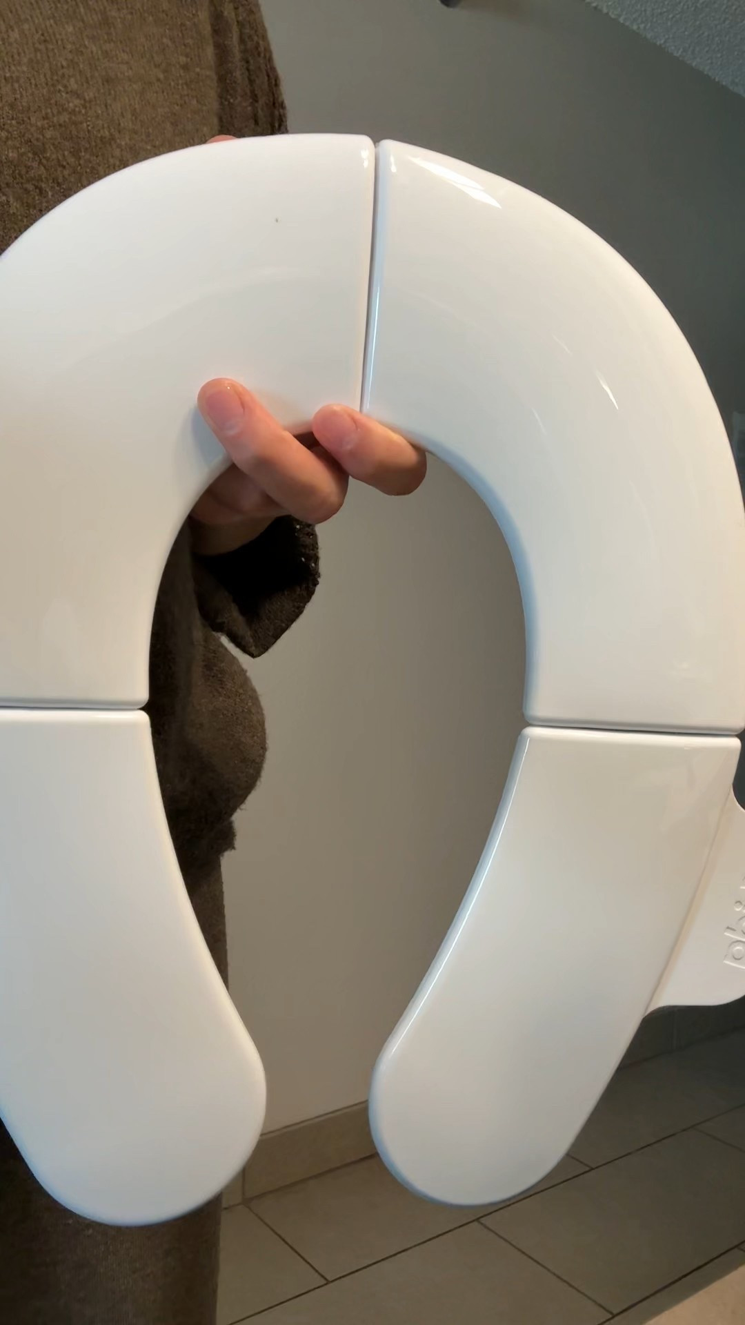 Fold and Go Potty Seat - I bring this with me everywhere we go.  It has flaps on the side that keeps hands off germs and touching other surfaces. It has a non slip base. And comes with a travel bag, so easy to get out and put away. So practical and perfect for traveling! 