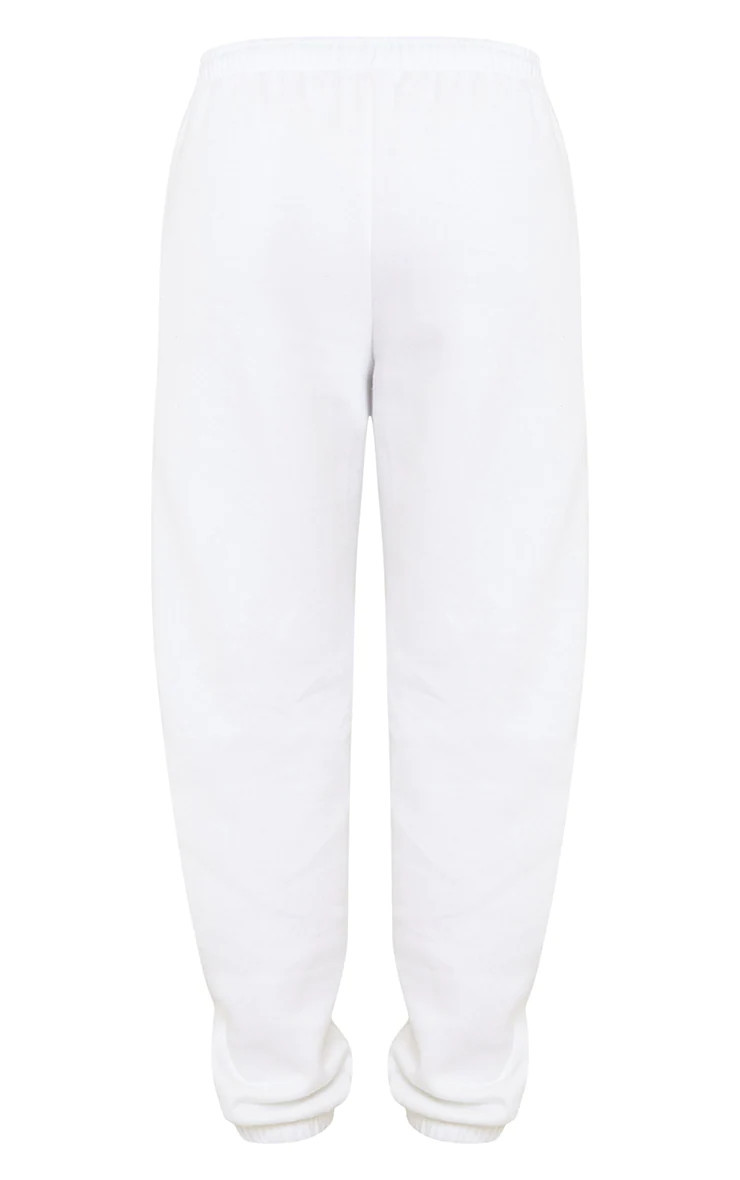 PRETTYLITTLETHING White Graphic Copyright Sweatpants | PrettyLittleThing US
