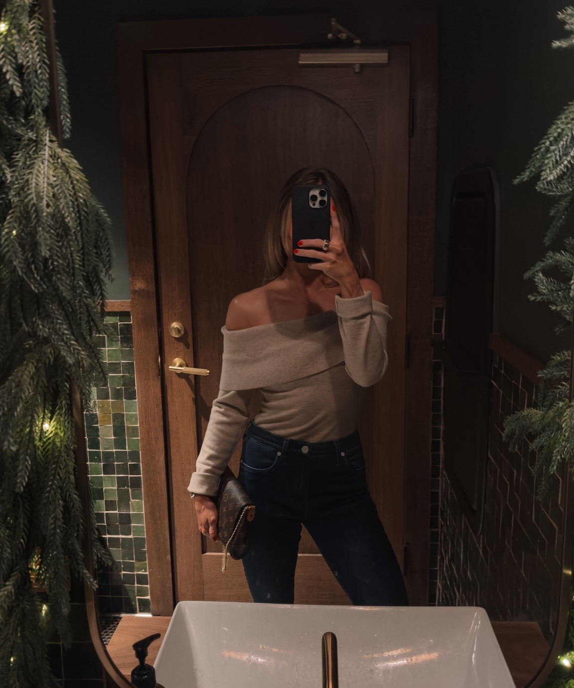 Revolve dinner outfit with this off the  shoulder sweater and dark flare jeans with some booties and fun accessories! 