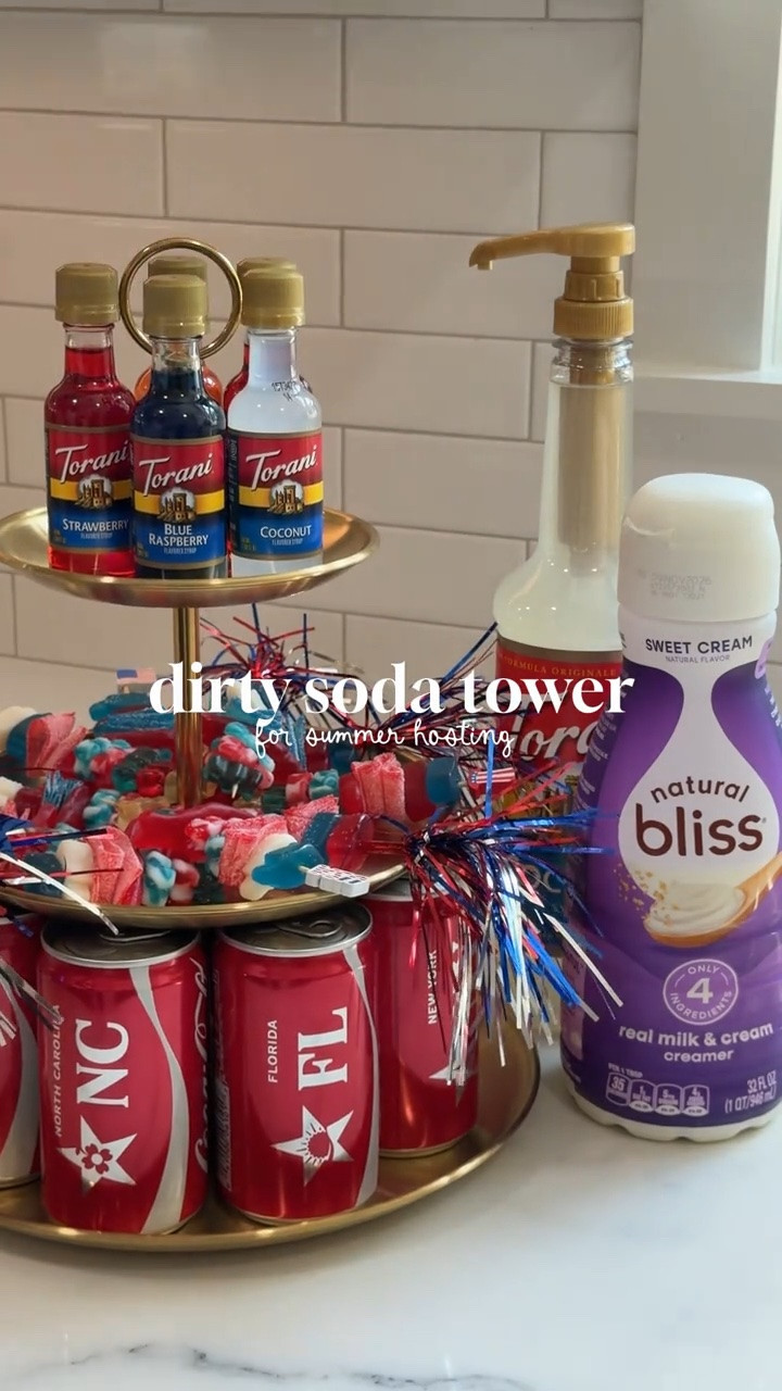 Dirty Soda Tower 🥤 🇺🇸💙

Hosting this weekend for the 4th or a watch party for a soccer game this summer?! This dirty soda tower will be a hit for your guests! Customize it however you want! I customized mine with mini torani syrups, festive candy garnishes and mini cokes! ✨ 

My go-to dirty soda recipe is a classic coke (or Diet Coke) with coconut syrup, sweet cream creamer and tonnns of ice - so refreshing for summer!!

#LTKfoodie #LTKSeasonal #LTKSaleAlert