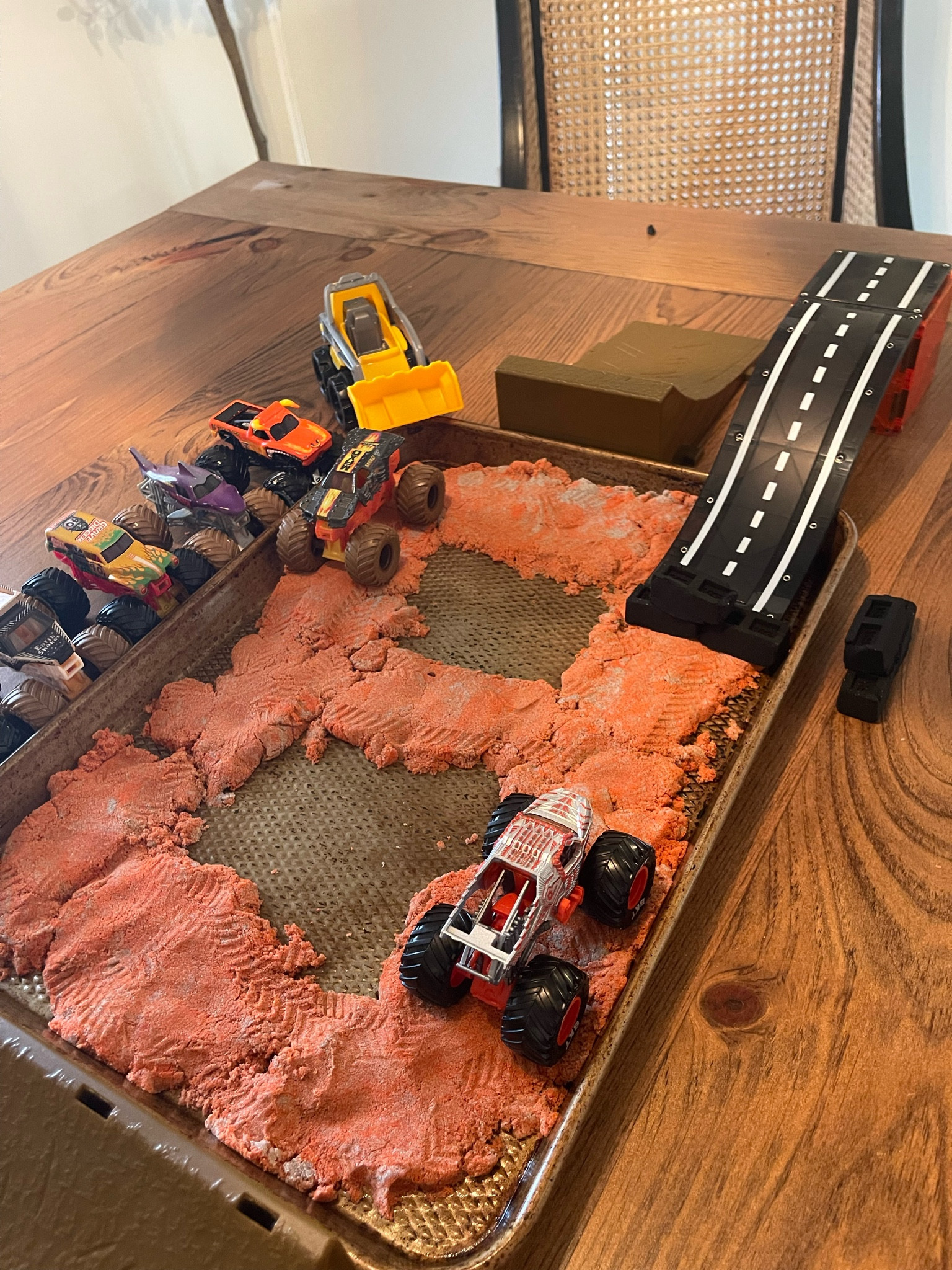 Using toys we already have to create a monster truck sensory station for my preschooler! 