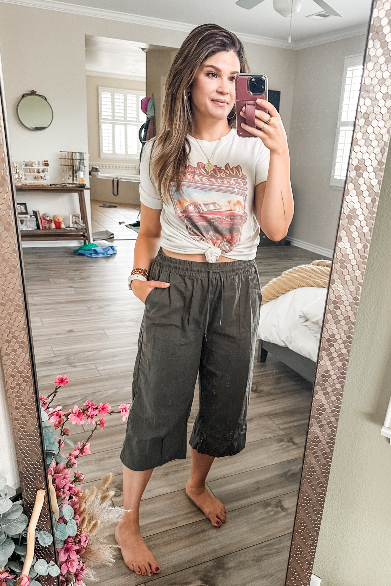 These are the perfect summer pants! Cropped linen with an elastic waist and functional tie. Two pockets in front and one in back. And SOOOOO comfy. 
I’m pairing it with a cute graphic and some gold jewelry. 
Medium in both the pants and the tee  

#LTKFindsUnder100 #LTKOver40 #LTKFindsUnder50