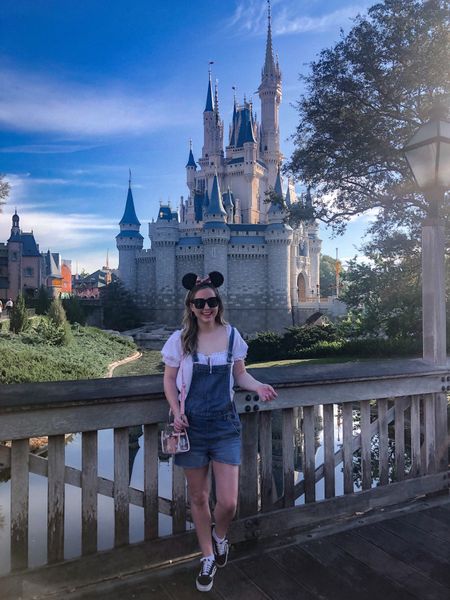 Ashley Butterfield of SideSmile Style shares a easy and comfortable outfit to wear to Disney World. 

Vans, Overalls, puff sleeve blouse, stadium bag, mickey ears.

#LTKFind #LTKtravel #LTKunder100