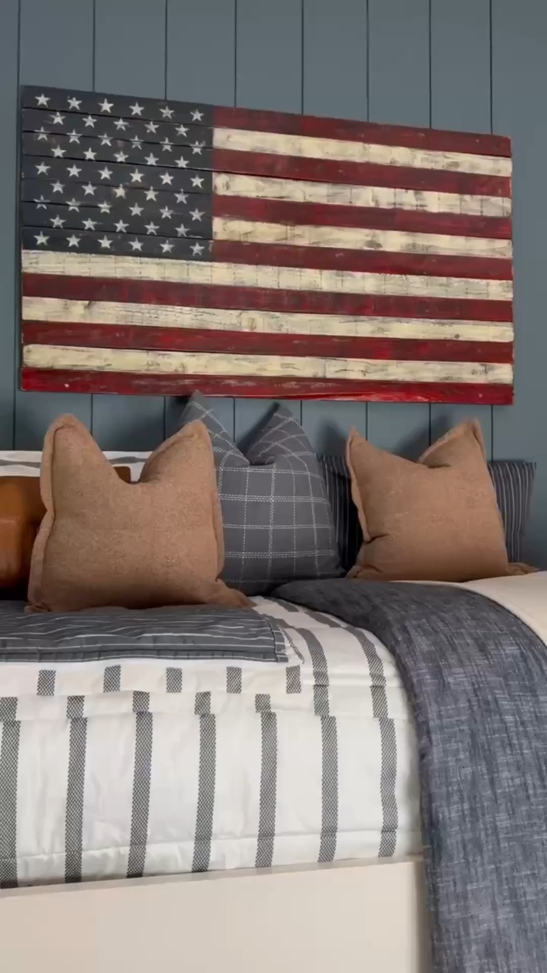 Warm + inviting 🤍 A white bed frame with striped bedding sets the stage, styled with cozy throw blankets and accent pillows for layered comfort. A rustic wooden nightstand with a brass wall sconce adds character, while patriotic American flag wall art brings personality. Finished with under-bed storage and a patterned rug for the perfect balance of style + practicality. 🌿

Bedding by Beddy’s 
Code EANES = 20% off 

Bedding Details: 
Chandler Beddy’s (Twin, Cotton, ZipBase)
Taylor Luxe Blanket 
On-the-go blanket tan grid 
Owen Luxe Leather XL Lumbar Pillow Cover
Lincoln Medium Pillow Cover
Monroe Medium Pillow Cover 
Lucas Euro Pillow Cover

#BedroomInspo #LayeredBedding #AccentPillowStyle #WoodFurniture #BrassLighting #AmericanFlagDecor #UnderBedStorage #RugGoals #CozyInteriors #eanesinteriors



#LTKvlog #LTKHome #LTKFindsUnder100