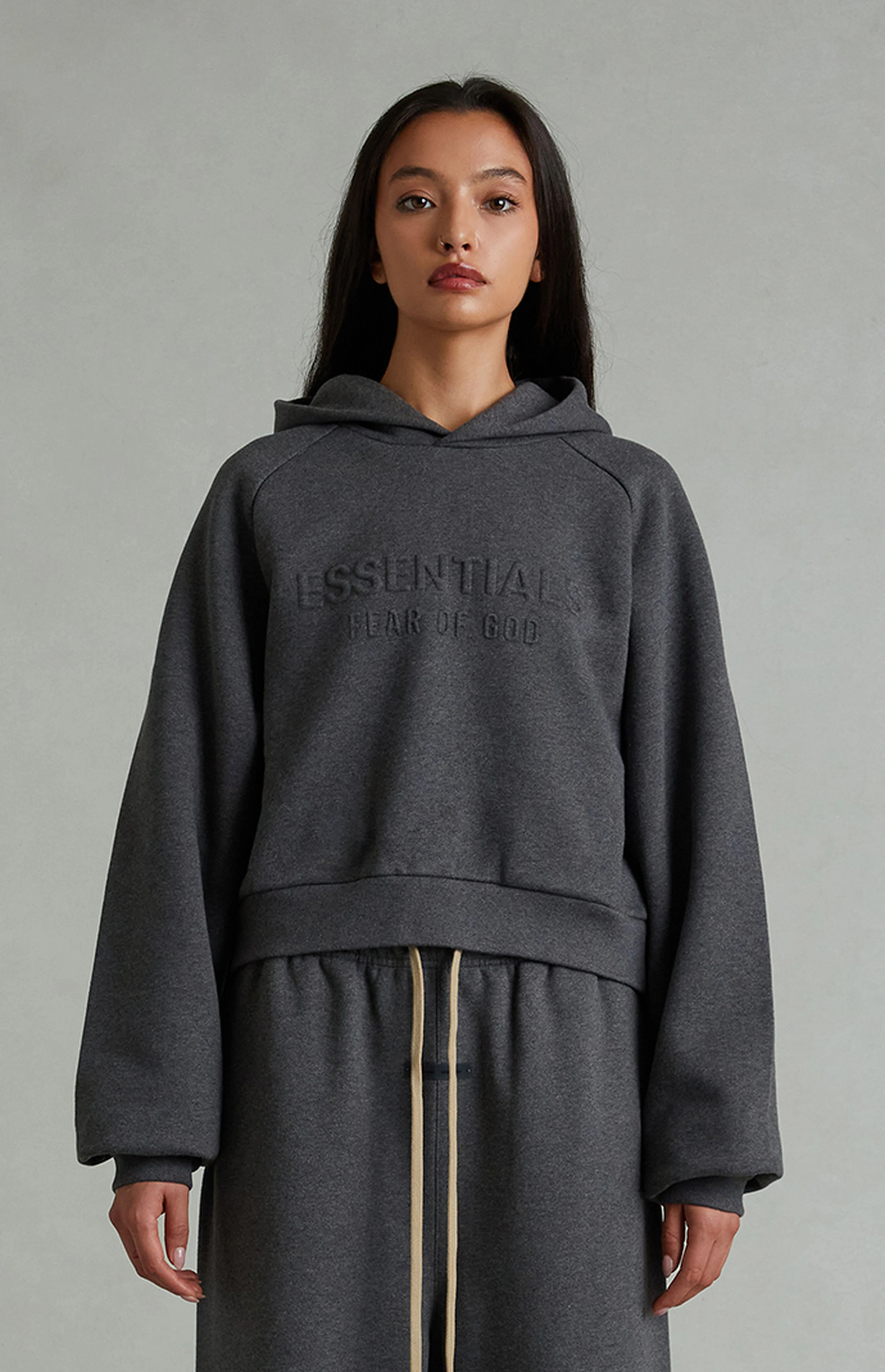 Fear of God ESSENTIALS Women's Charcoal Heather '90s Embossed Raglan Cropped Hoodie | PacSun