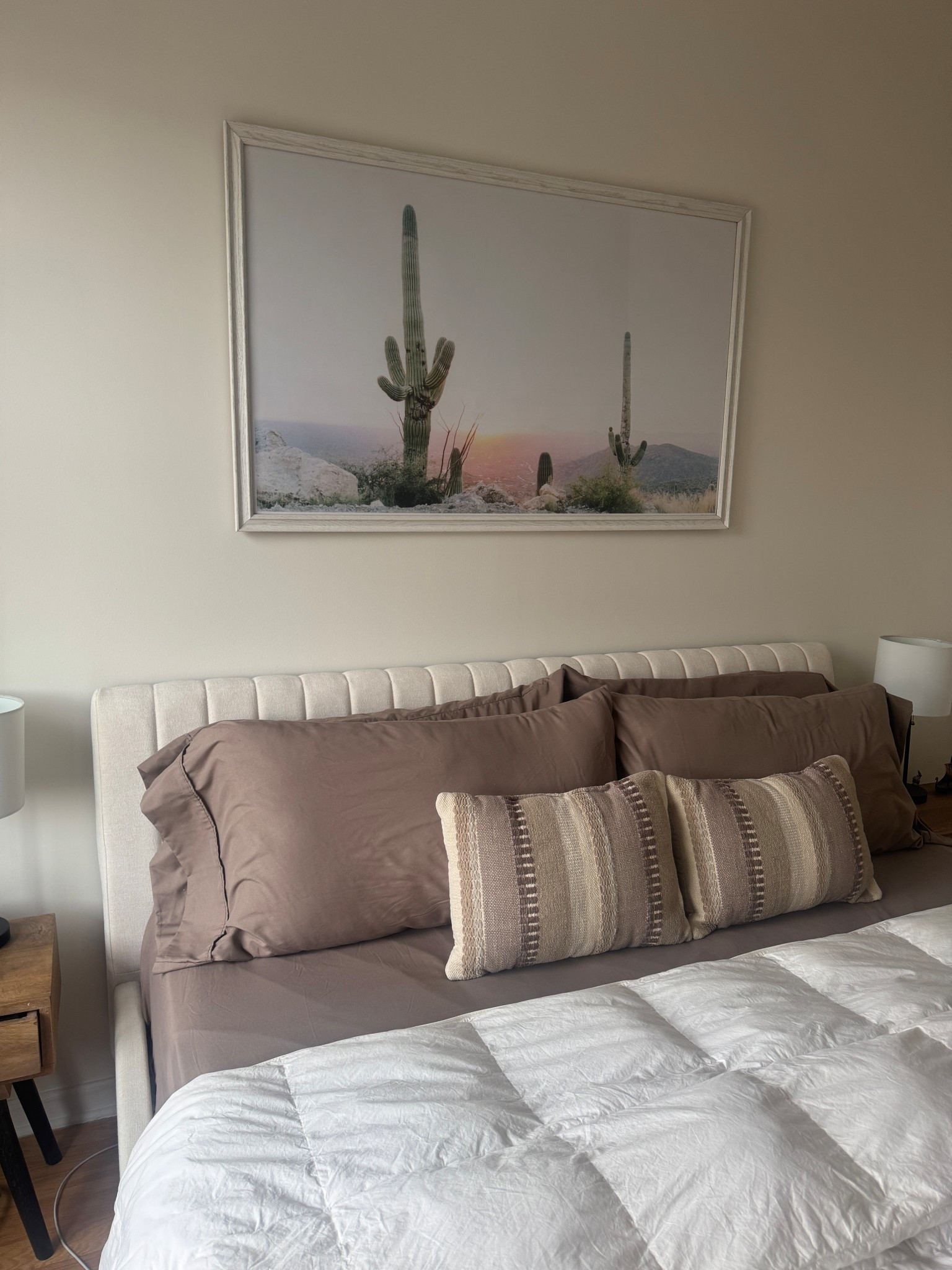 Loving these mocha brown bed sheets that I found! Pairs well with our neutral striped throw pillows and the dessert wall art above the bed. Also been folding the comforter a bit differently to show more of the sheets! I’m obsessed with our bed now! 

#LTKHome