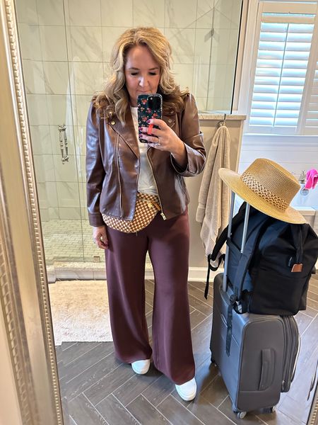 Travel look! 
Faux leather that’s lightweight, doesn’t wrinkle and is super chic! Wearing adixe 2.5 petite do lots of room to layer. Love the cropped style. 

Spanx air essentials size 2.5 petite in pants. The XL sweatshirt in my bag for the overnight flight. Worked great! 
Crossbody that works as a Fanny pack too. So good. 
Sneakers are good. But truth be told I’m wishing I had brought my Paul greens. But these are a great inexpensive option. 

Travel look travel style 

#LTKtravel #LTKSeasonal #LTKmidsize