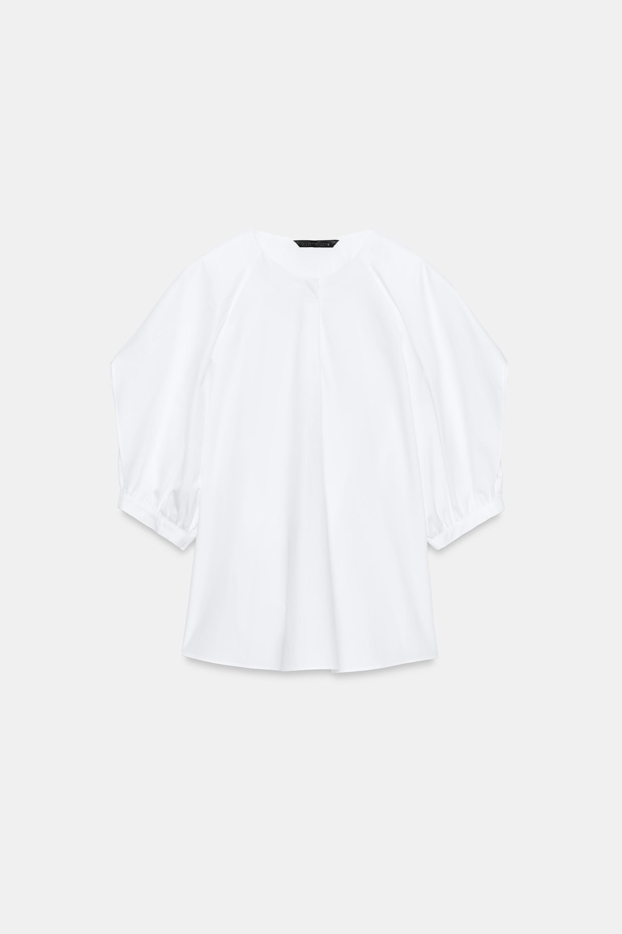 ZARA WOMAN COLLECTIONShirt with main fabric made of cotton yarn. Round neck and sleeves with plea... | Zara US