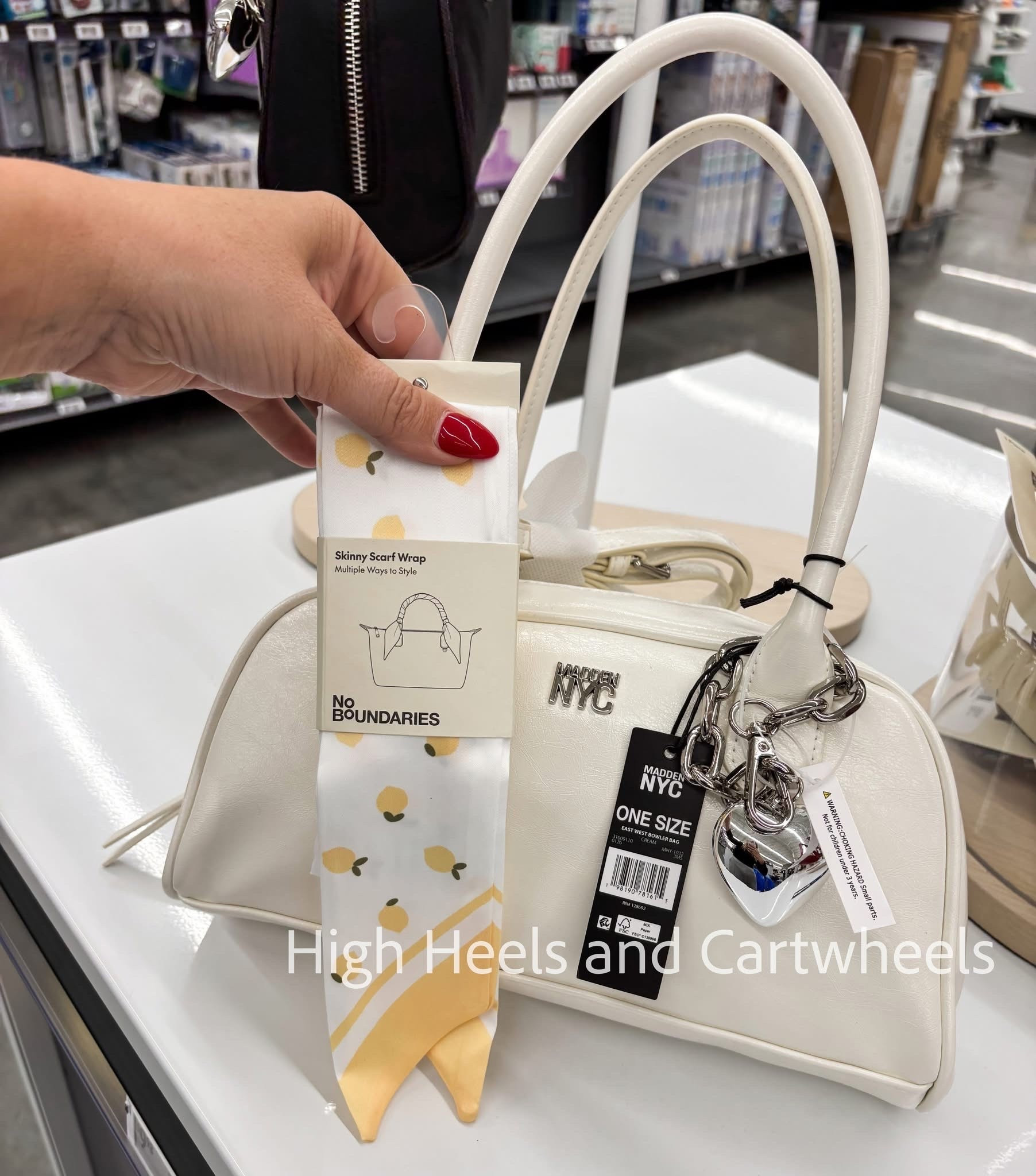 So fun and trendy to wrap a skinny scarf around your purse handle. This is the perfect combo!