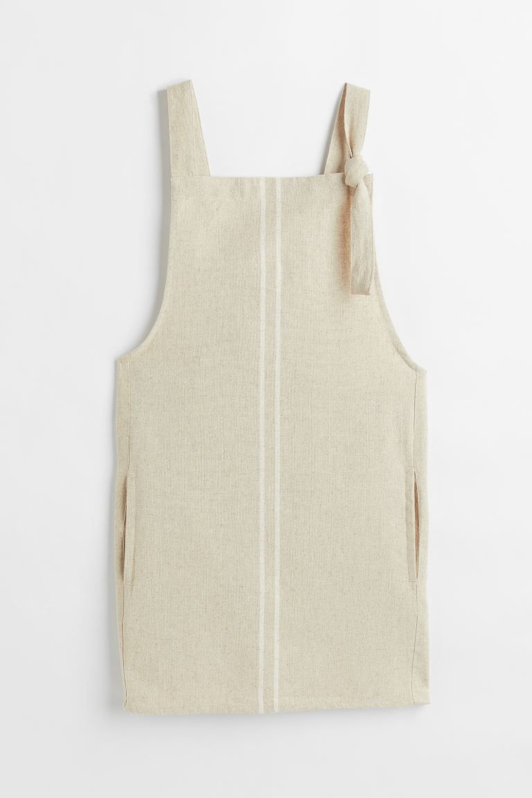 Apron in a woven linen and cotton blend. Wide shoulder straps extending over back to tie at one s... | H&M (US + CA)