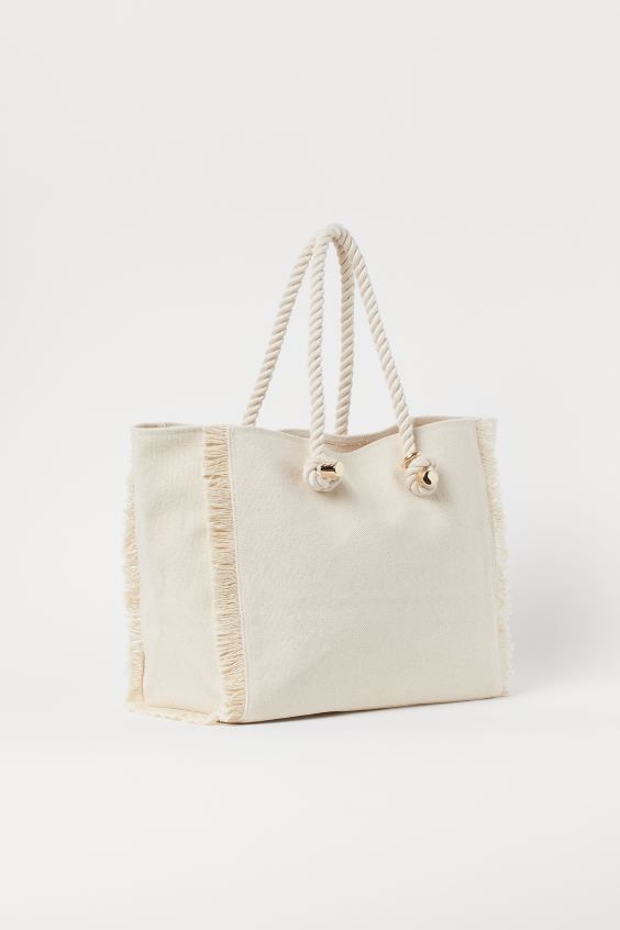 Shopper in cotton canvas with fringe at short sides, two rope handles at top with metal ends, and... | H&M (US)