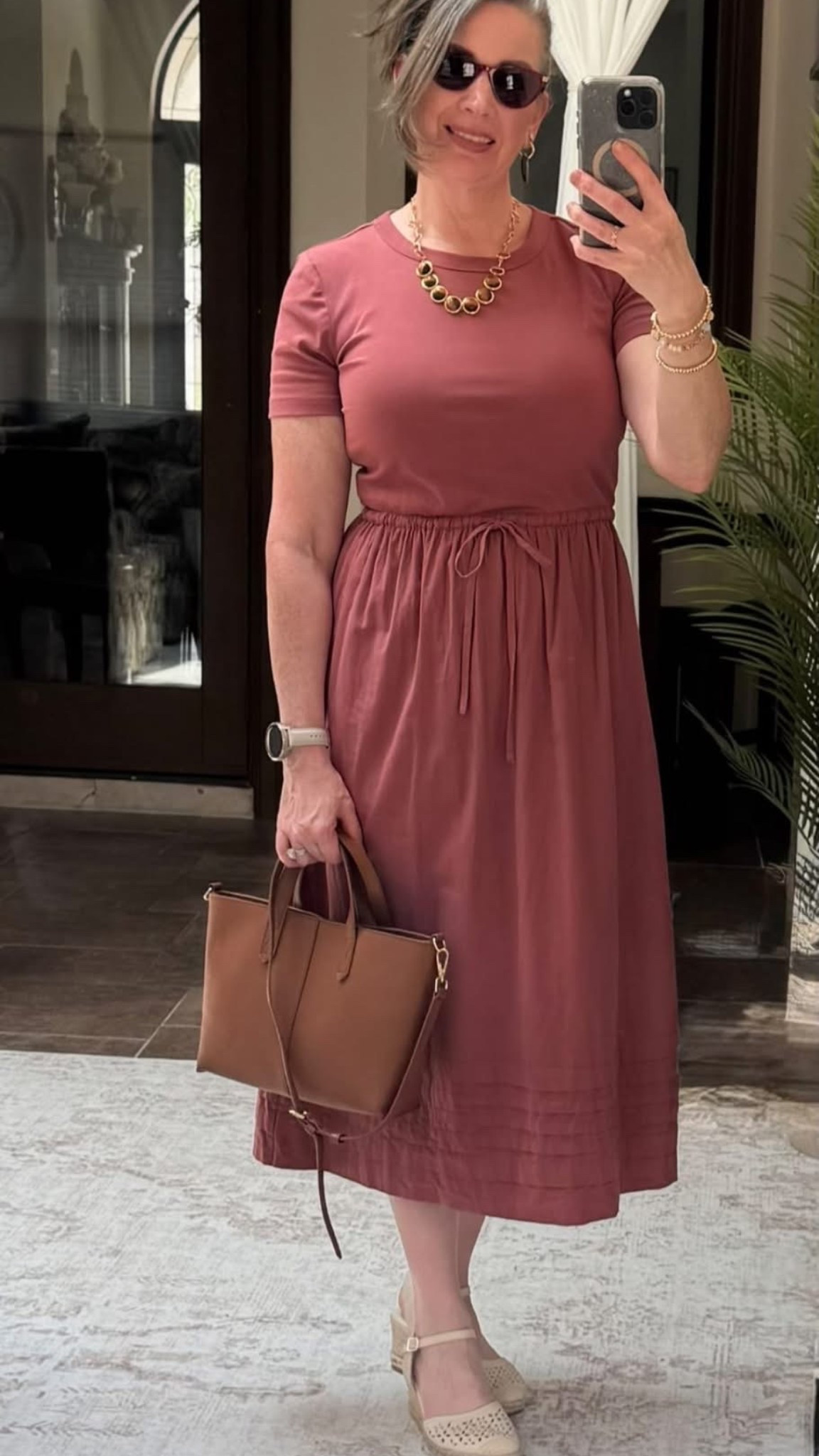 🤎 This dress was an instant yes.

It’s soft, comfortable, has an easy feminine silhouette, and the color is one of those warm earthy shades I can’t resist.

I paired it with my favorite neutral handbag, gold jewelry, and the comfy eyelet shoes I’ve been wearing on repeat lately. It’s one of those outfits that feels polished without trying too hard.

I love finding pieces that can take you from brunch to work, church, or dinner just by changing a few accessories.

Everything is linked here if you’d like to recreate the look. 🤎✨

#LTKStyleTip #LTKOver40 #AnnTaylorStyle #ClassicStyle #WearWhoYouAre

#LTKootd #LTKWorkwear #LTKTravel