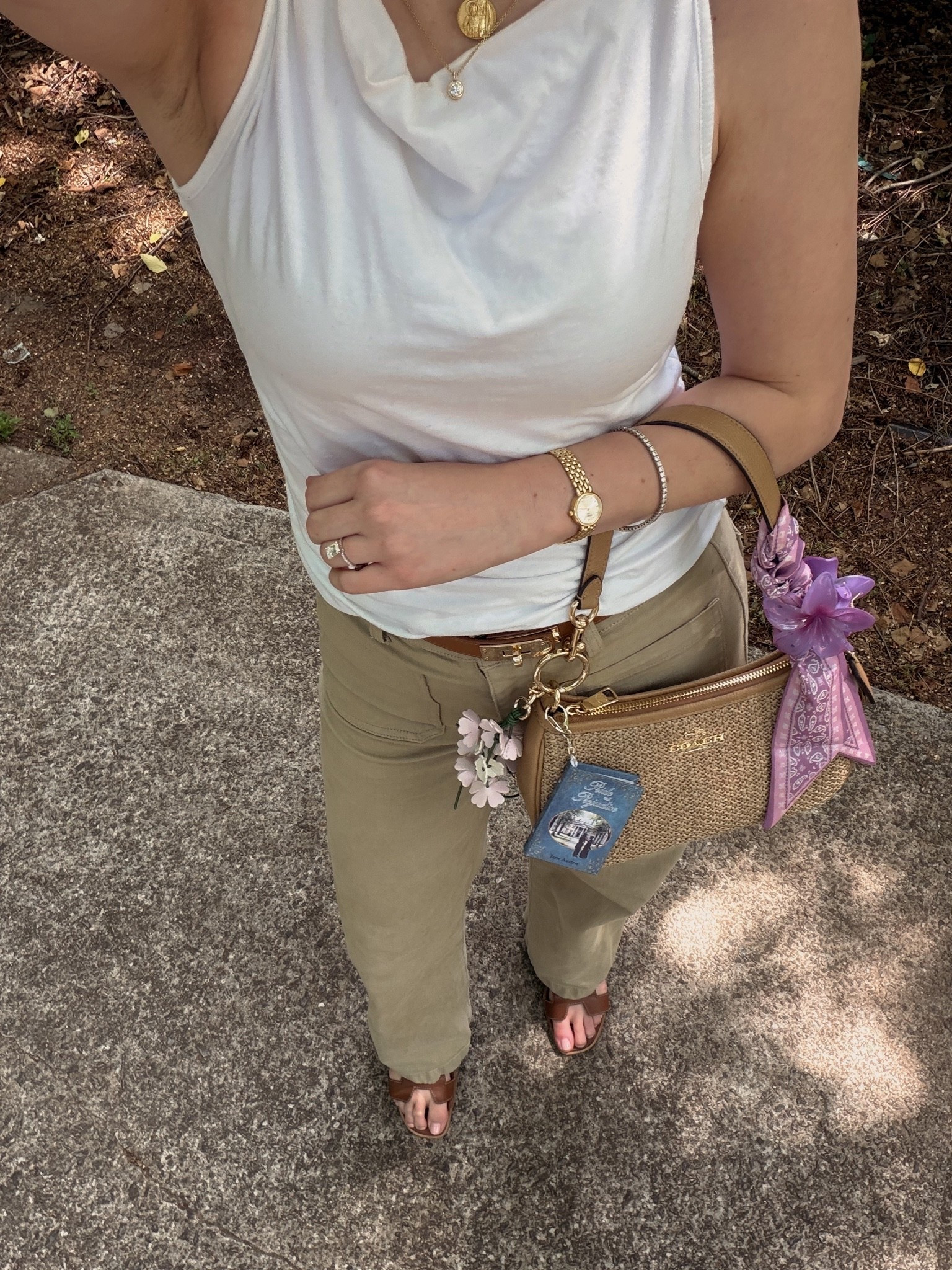 OOTD
White boat neck tank
Madewell khaki pants
Coach outlet raffia Teri 
Pride and prejudice mini book bag charm

#LTKootd #LTKdayinmylife #LTKxMadewell
