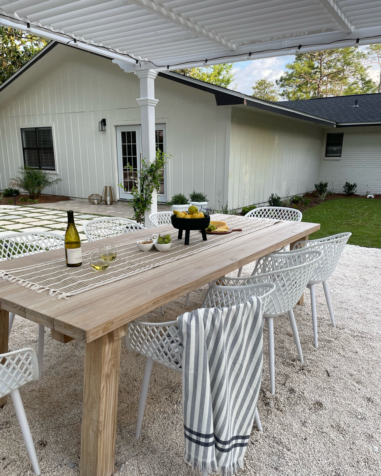 Backyard design, white outdoor chair, patio chair. White pergola from wayfair and white chairs are also from Wayfair! 
