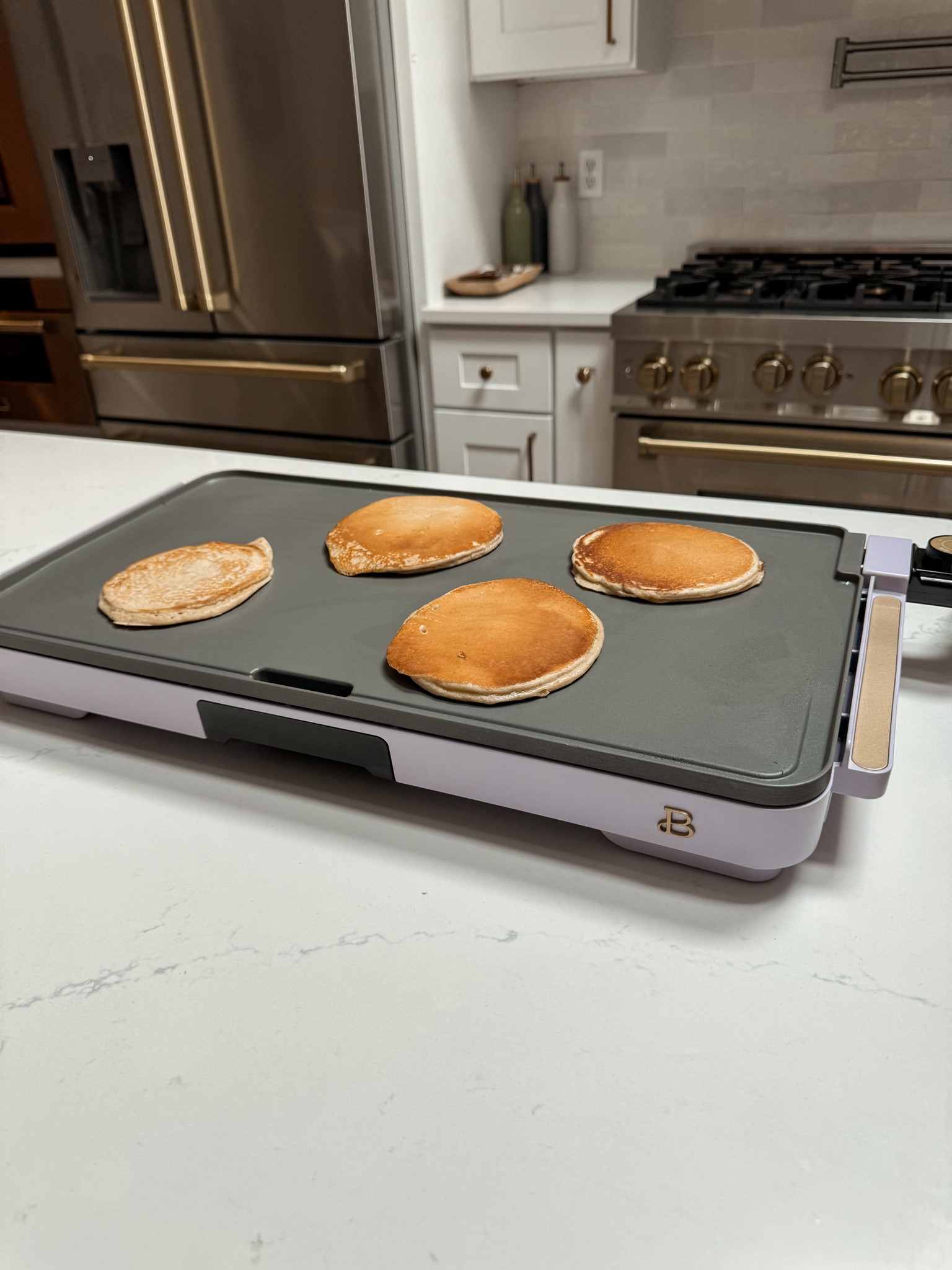 We got the new Beautiful by Drew Barrymore griddle from @walmart and it makes the most golden perfect pancakes!! #WalmartPartner It comes in tons of cute colors, obsessed with the purple 😍 #WalmartHome 

#LTKHome